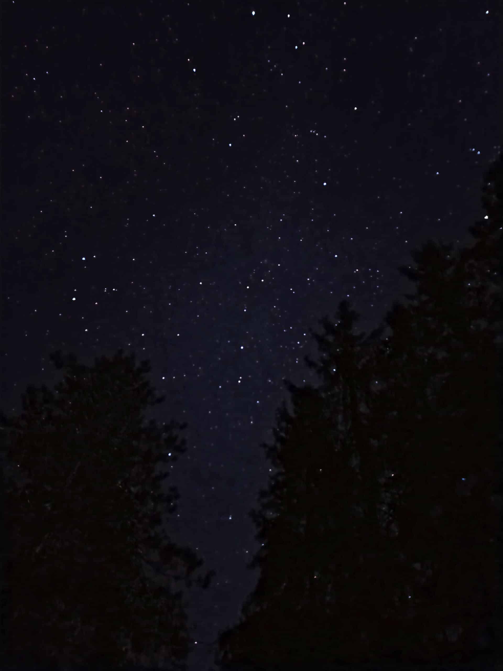 The night sky over mew lake, clear with a lot of stars visible.