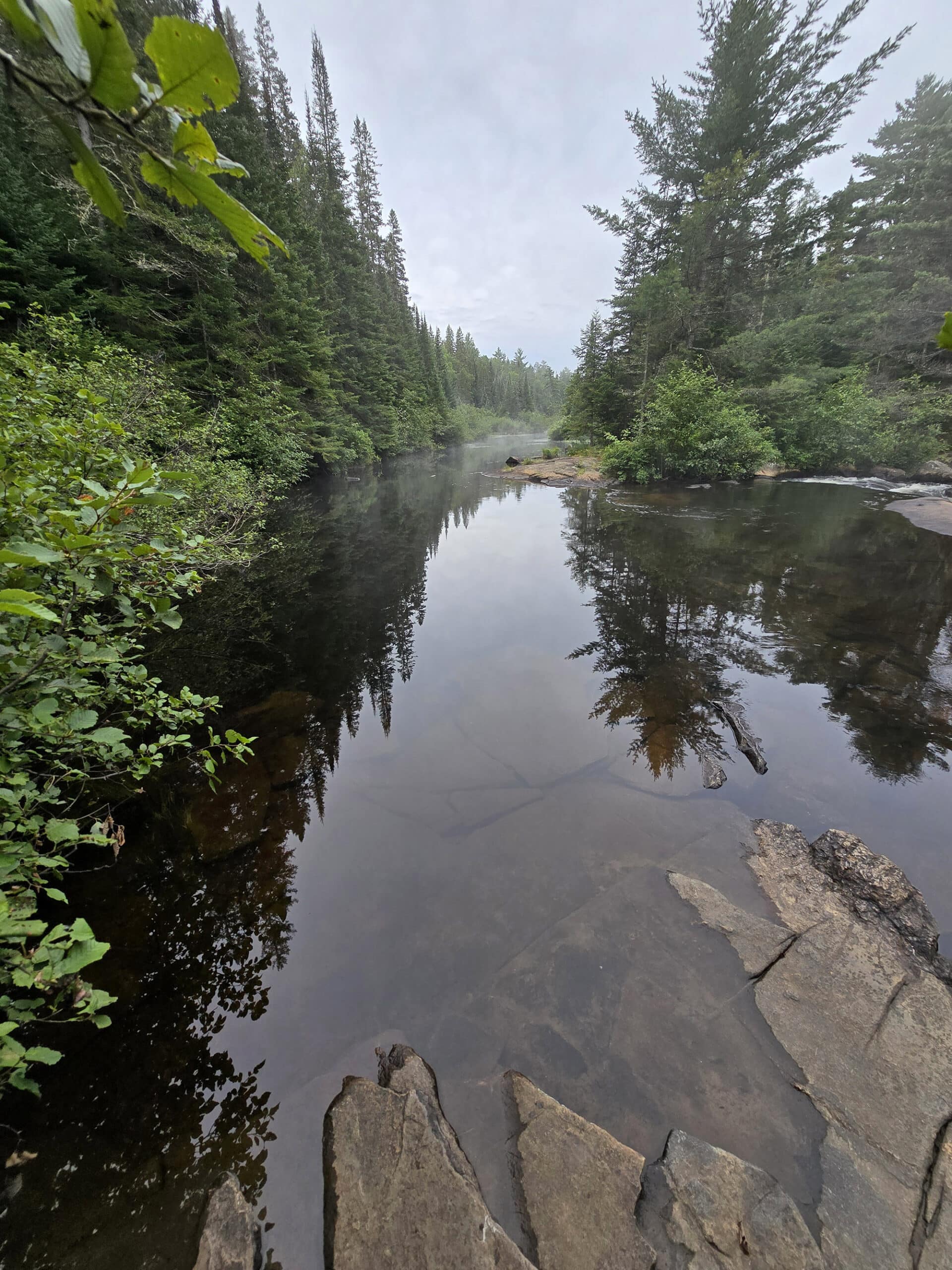 Rocks and still water on the madawaska river.