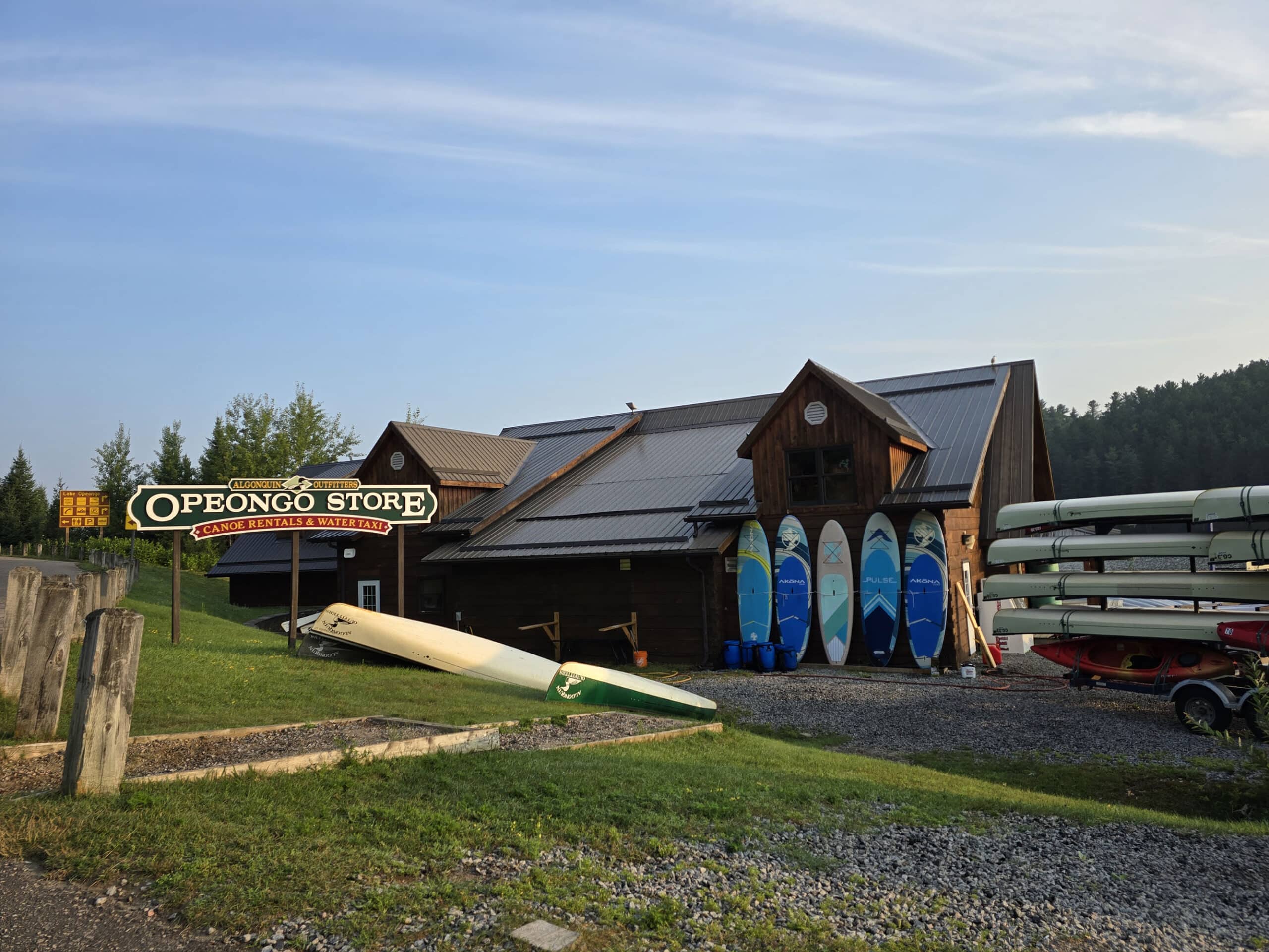 The opeongo store with canoes and kayaks out front.