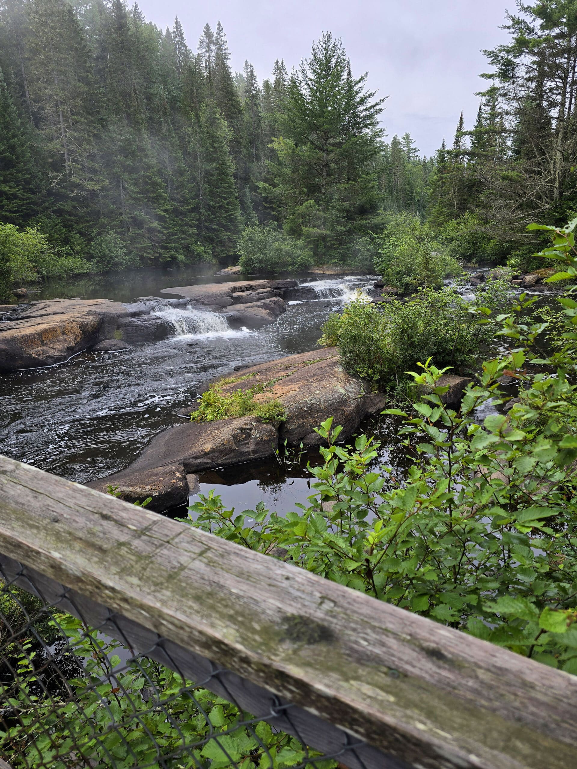 Provoking waterfall, viewed from a wooden bridge.