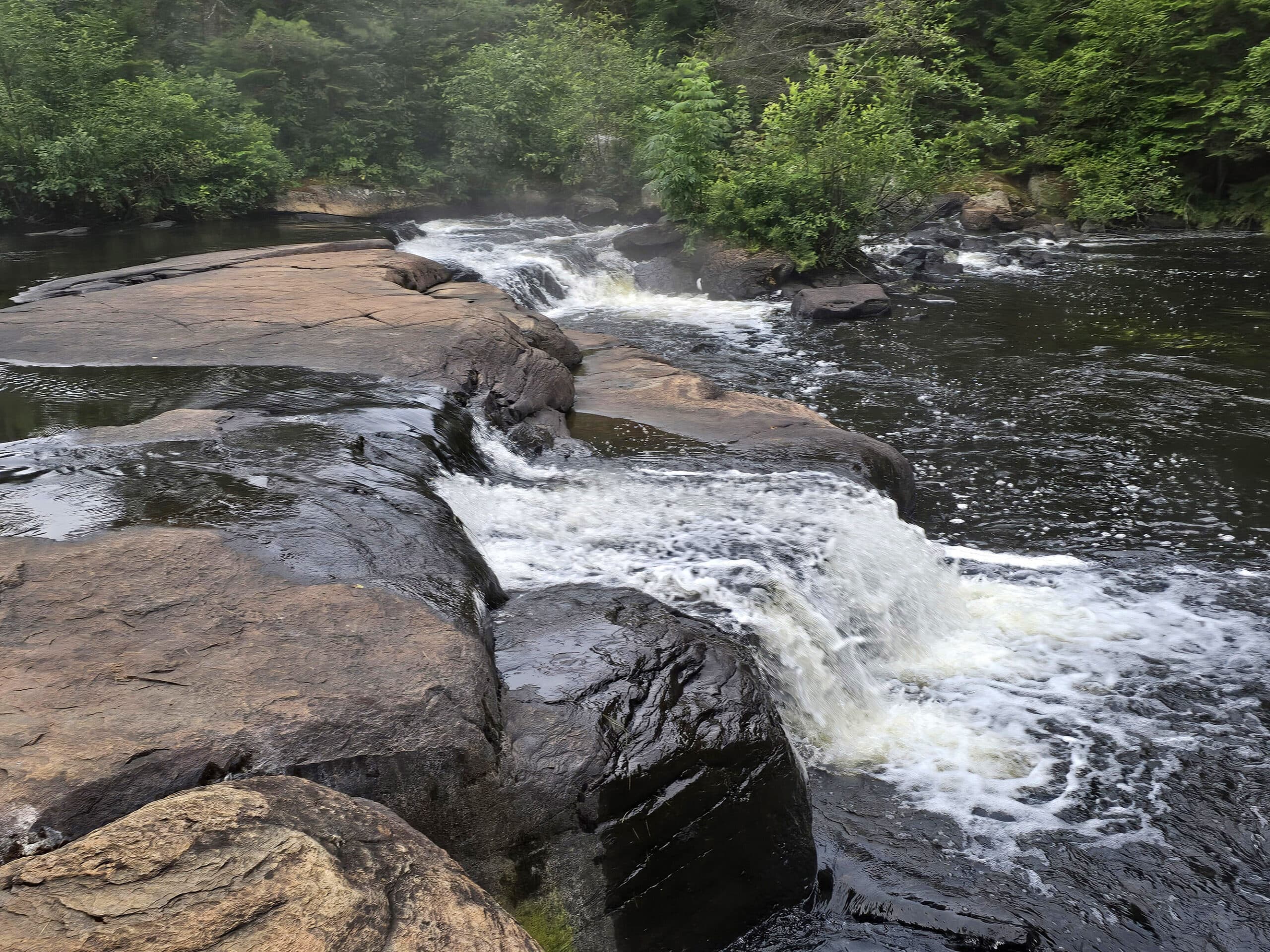 A double waterfall on the madawaska river in algonquin provincial park.