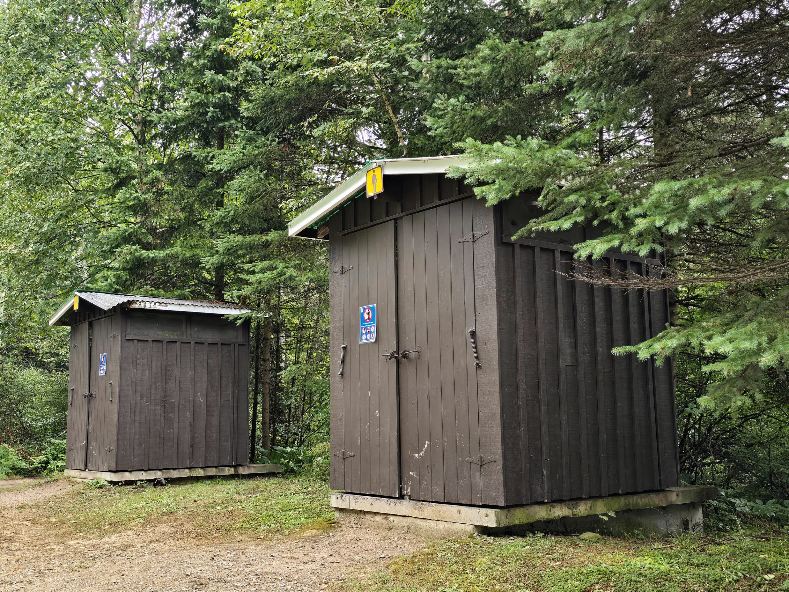 Two of the outhouses at Whitefish Lake campground.