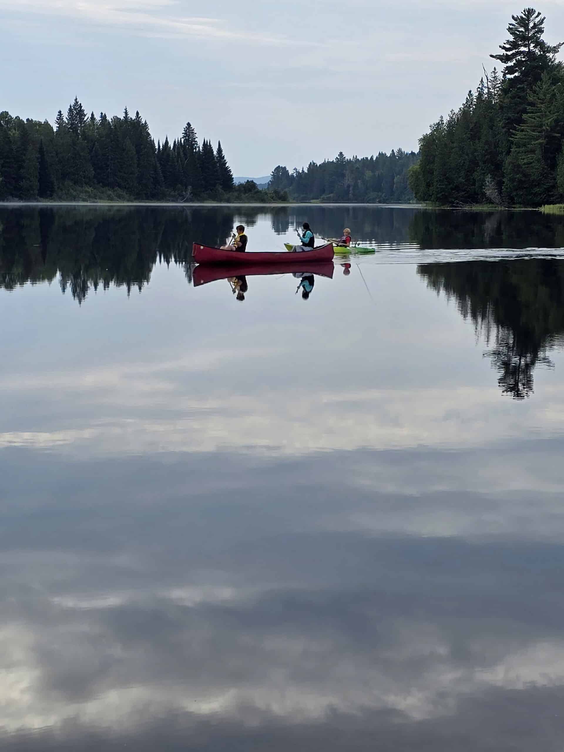 People canoeing on whitefish lake.