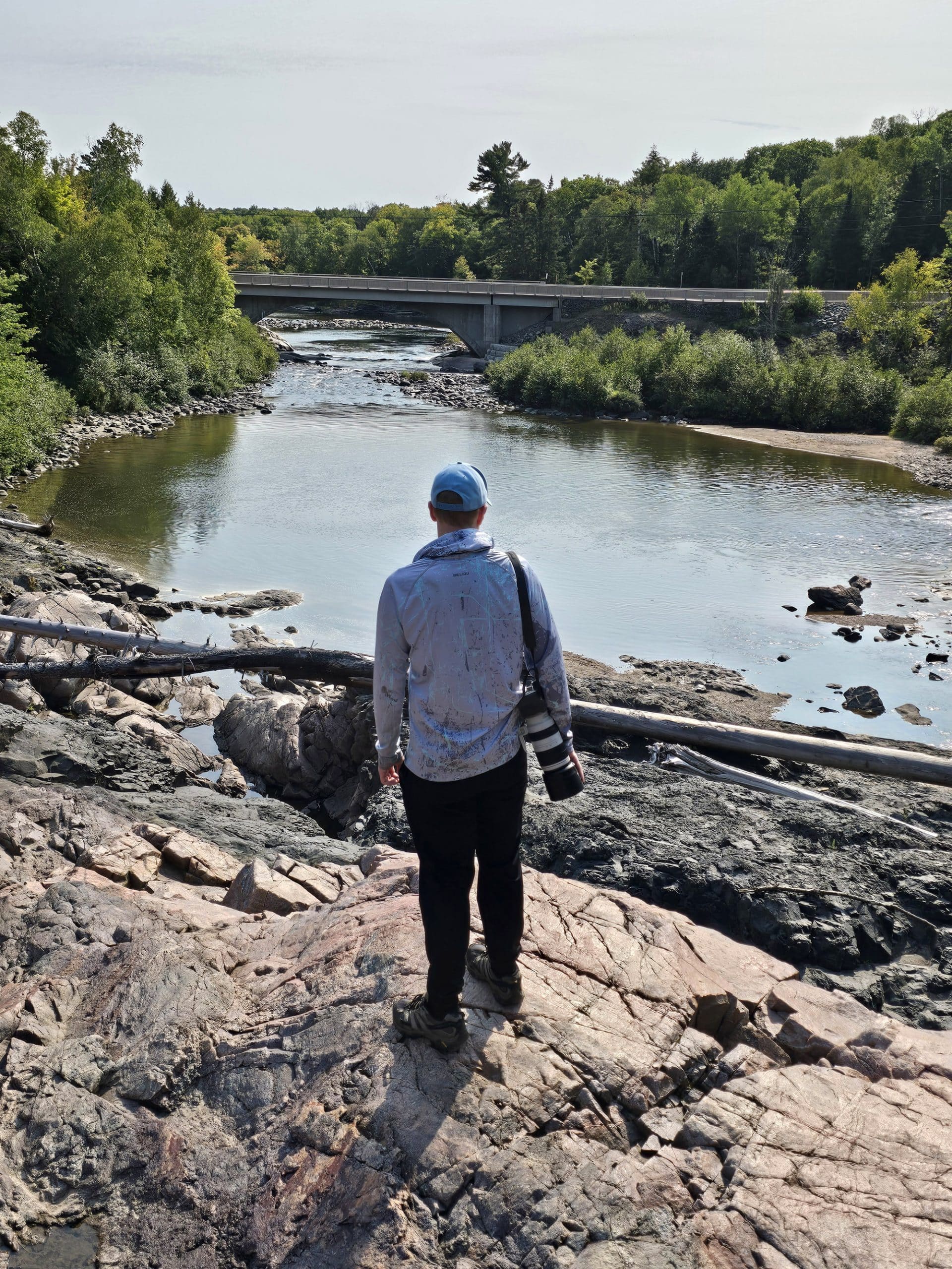 A man overlooking the chippewa falls river gorge.