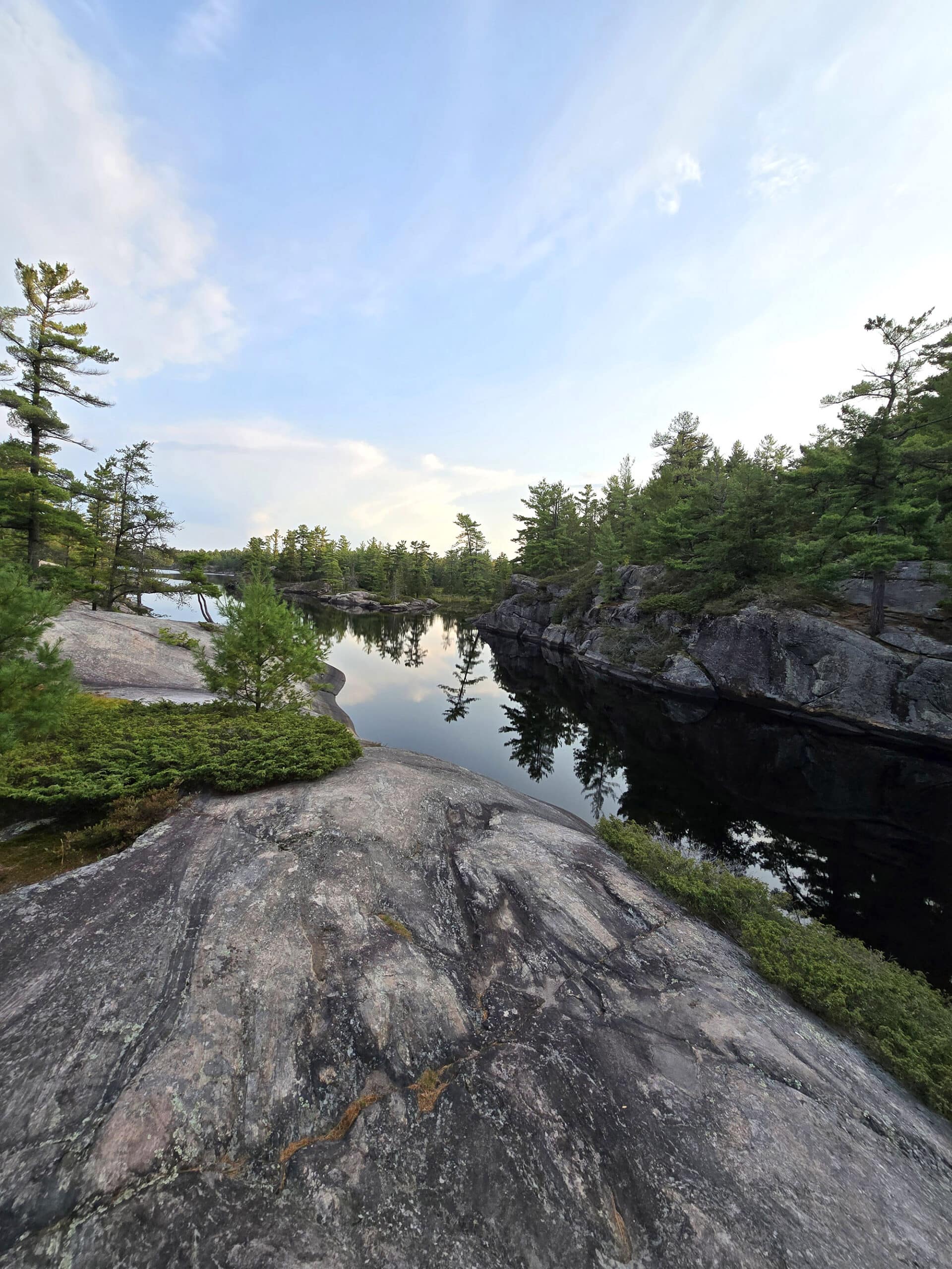 A rocky ledge overlooking Gut Lake