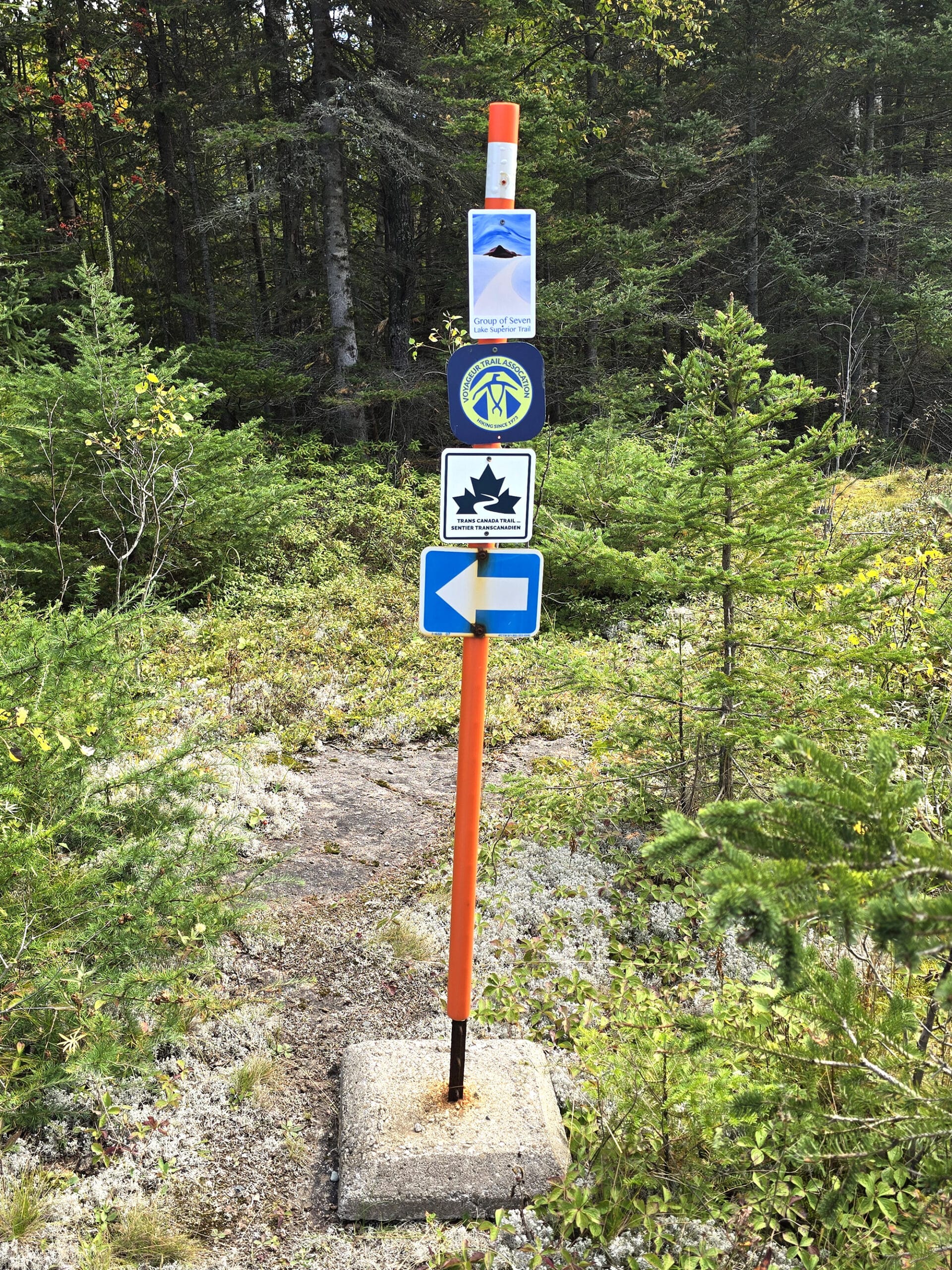 Trail signage for the trans canada trail, mink creek falls, and snowmobiling.