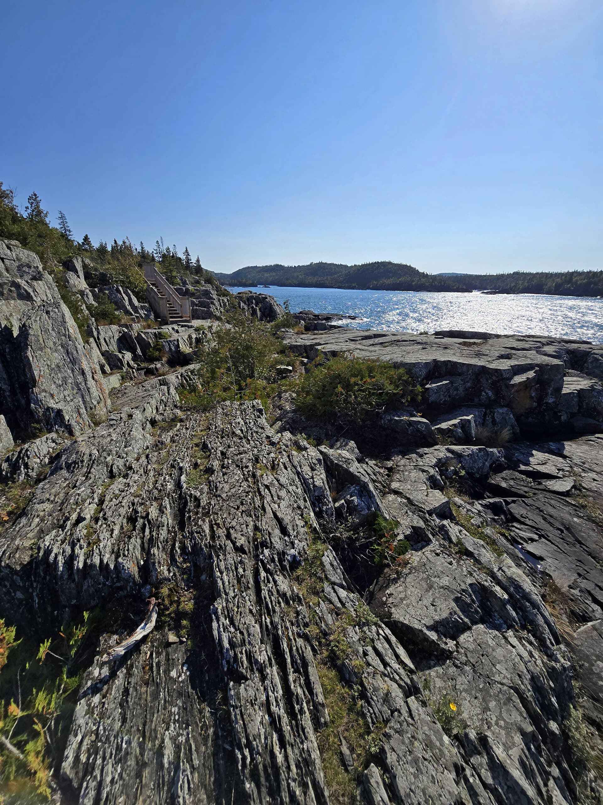 A view of lake superior, over a rocky ledge.