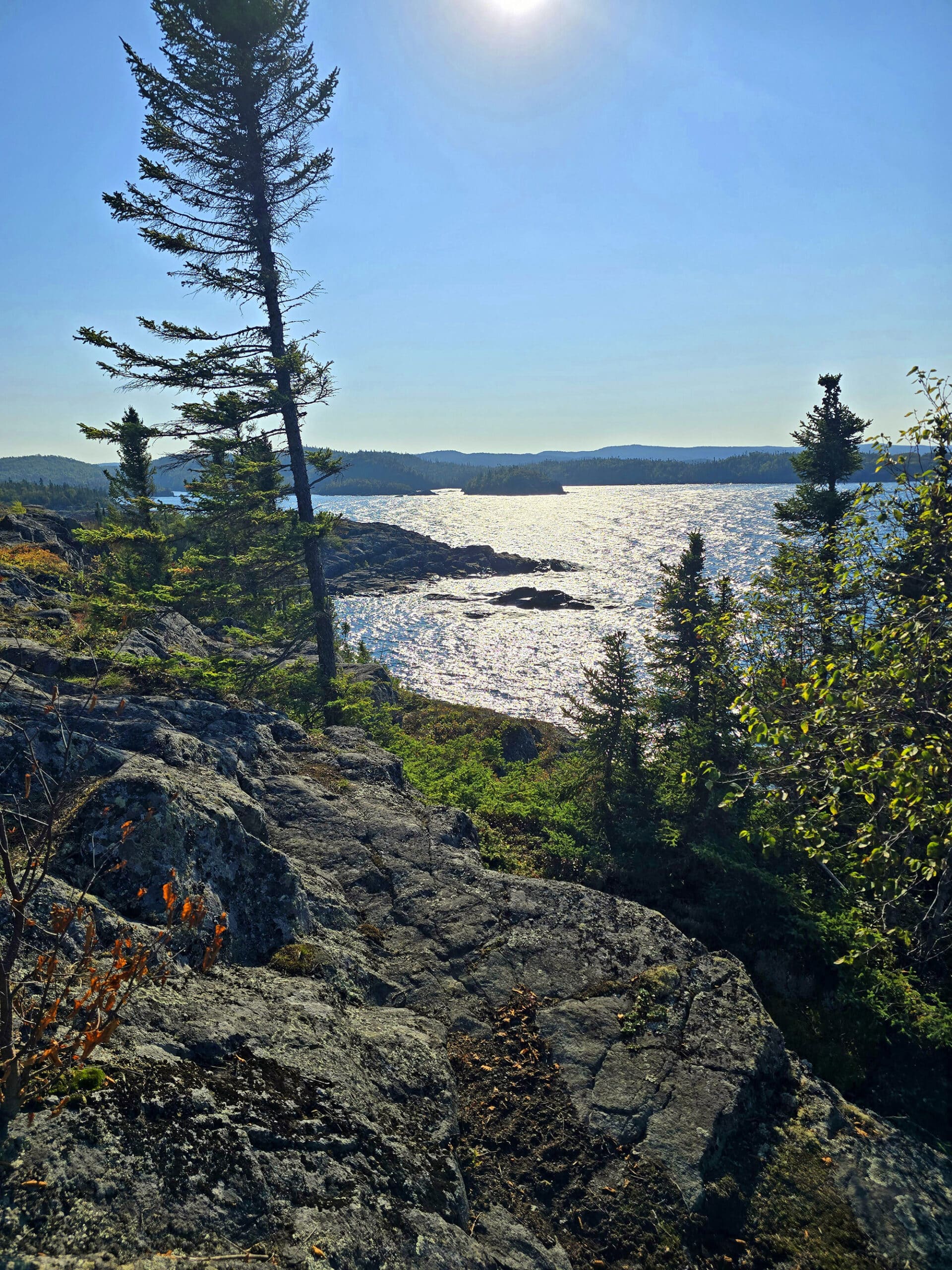 A view of lake superior, over a rocky ledge.