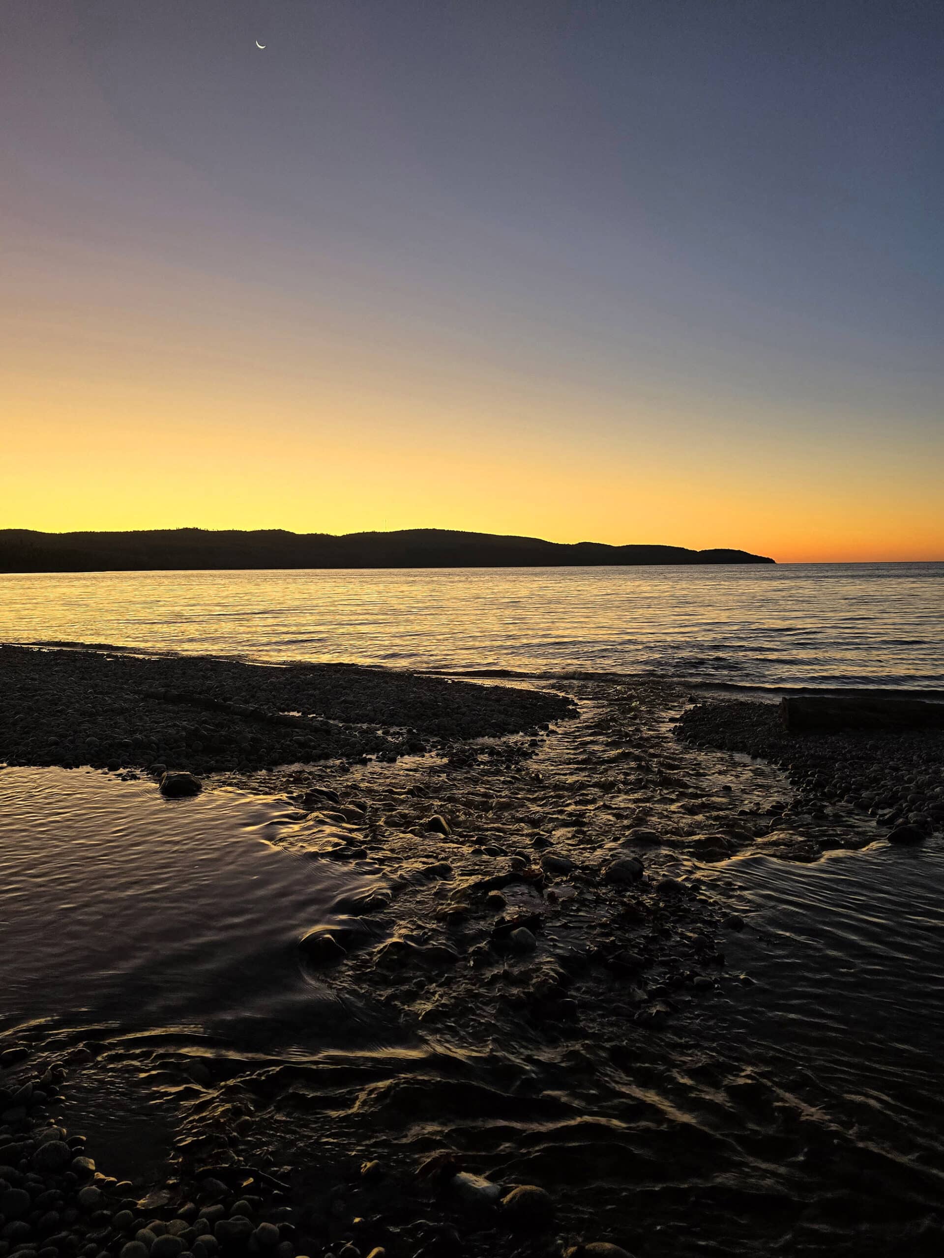 Sunrise over a salmon run on Lake Superior.