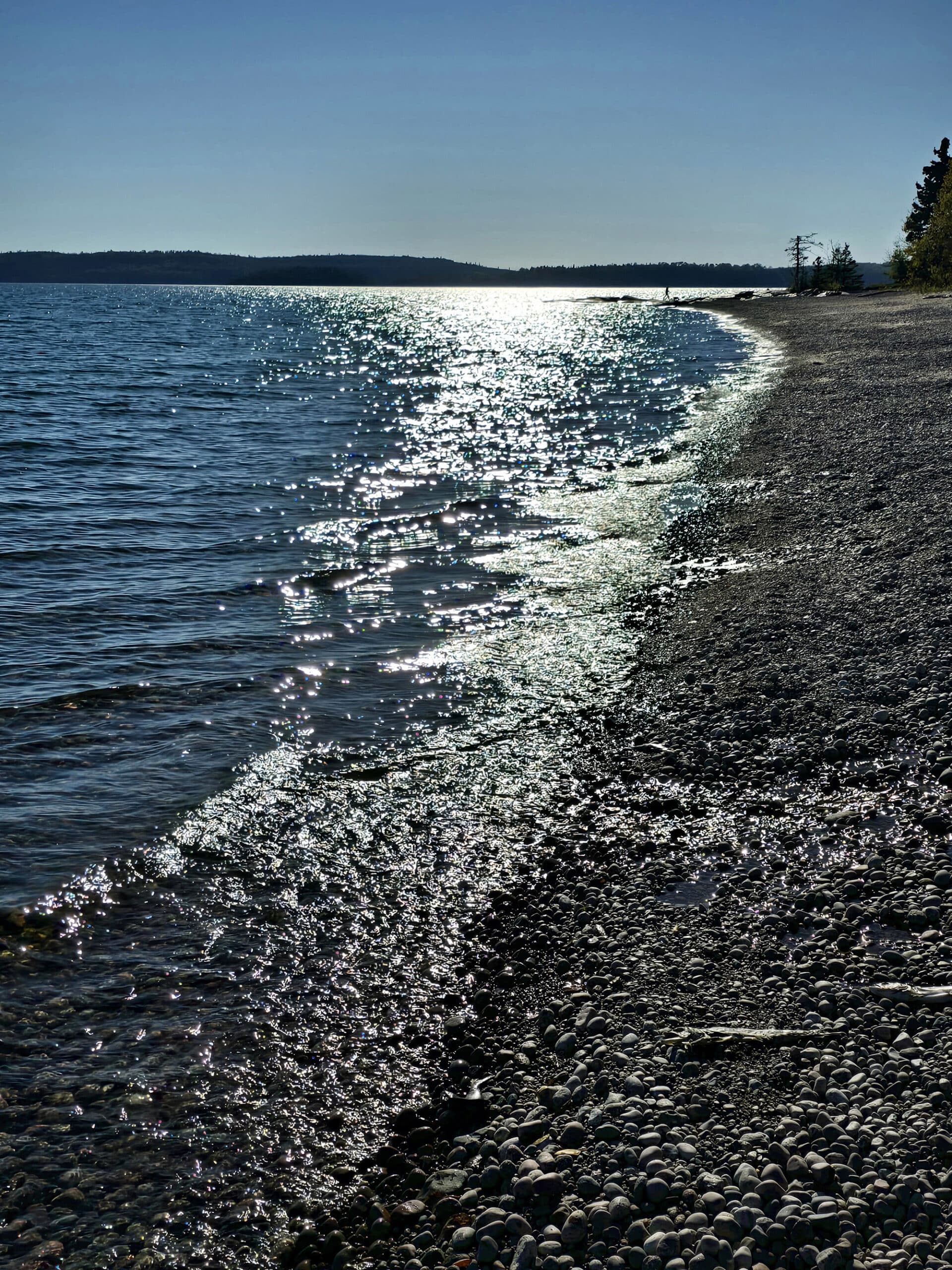 Lake superior shoreline with waves and sunshine.