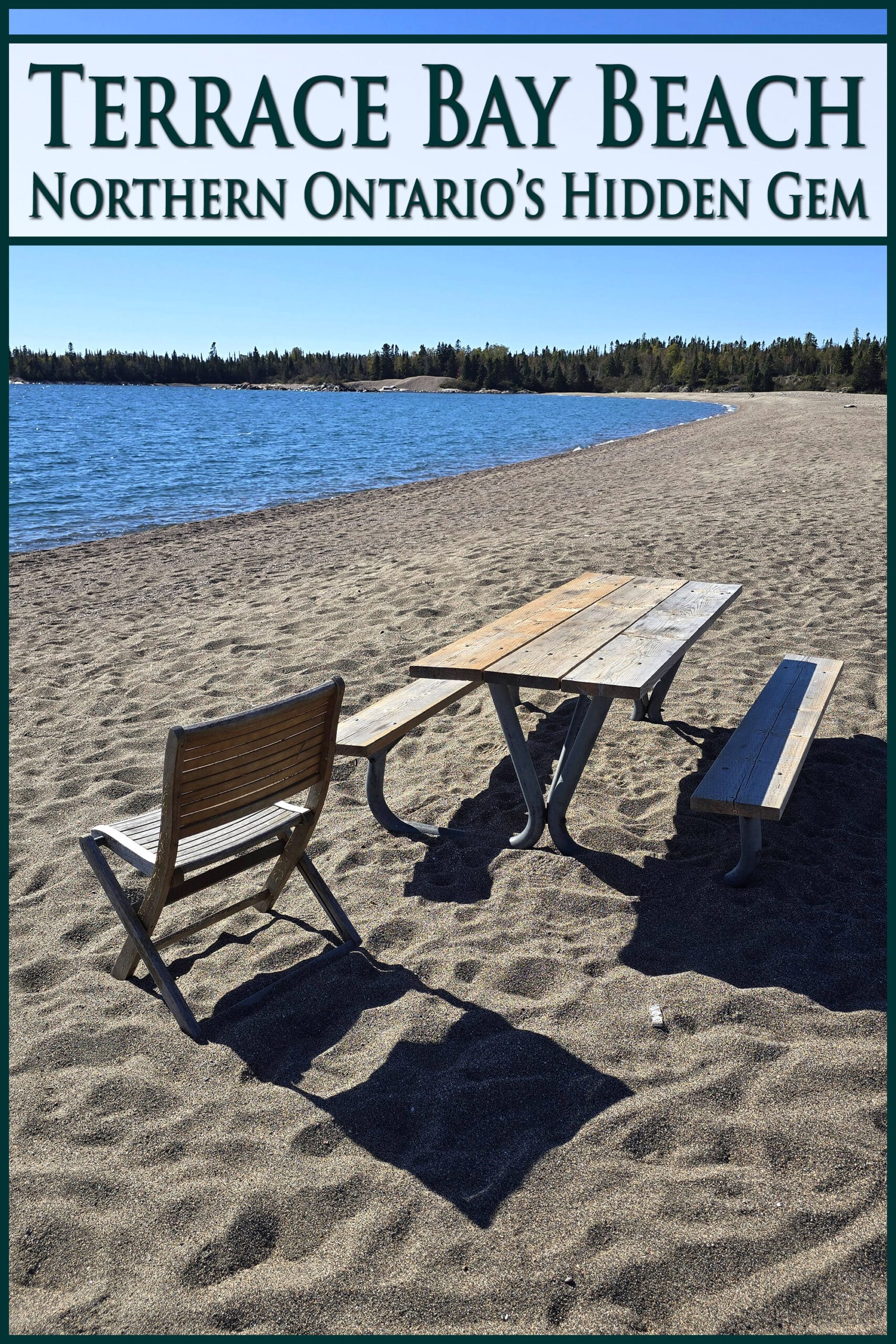 A picnic table and chair on a rocky beach. Overlaid text says terrace bay beach northern ontario's hidden gem.