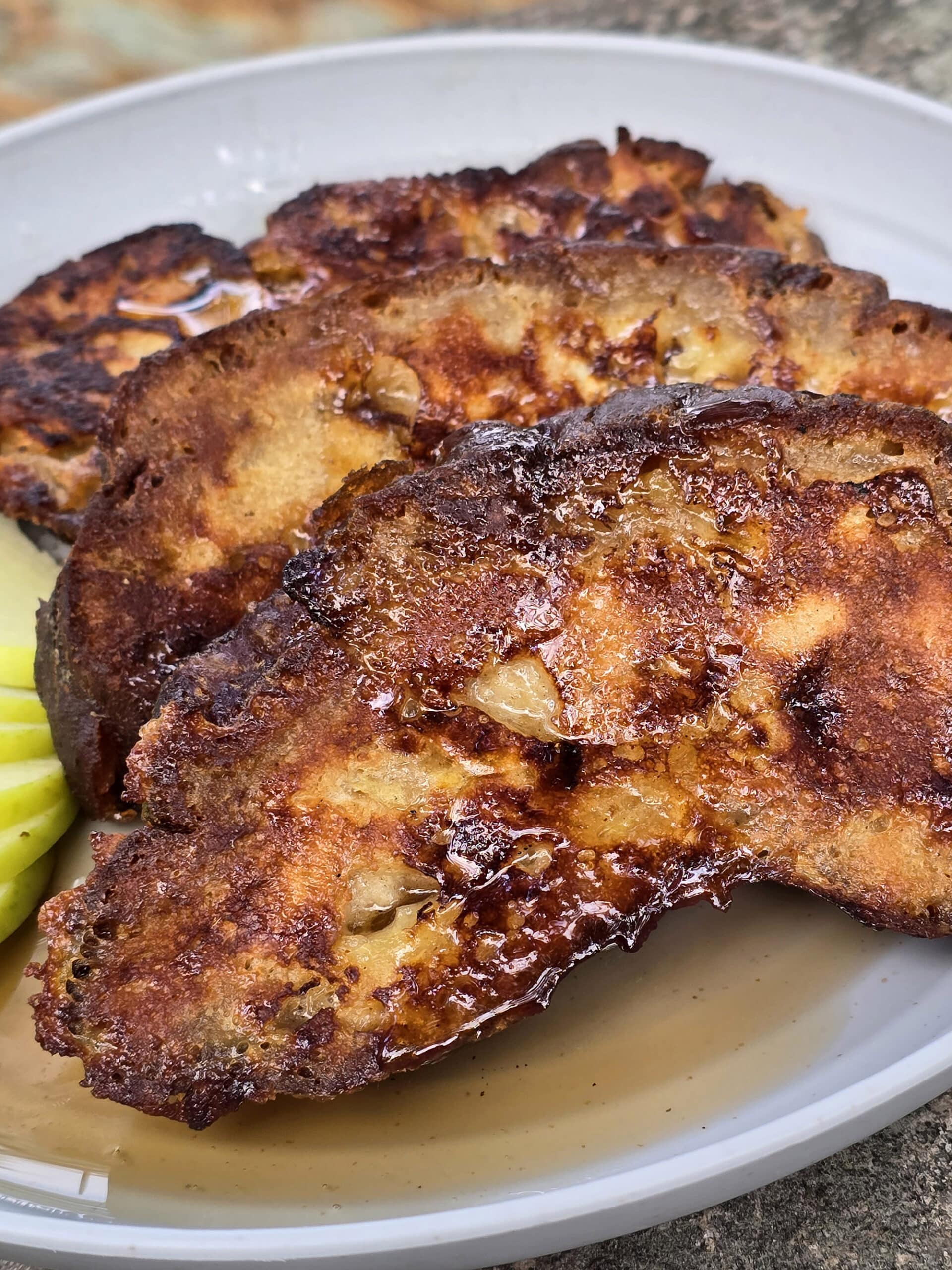 A plate of apple fritter french toast slices.