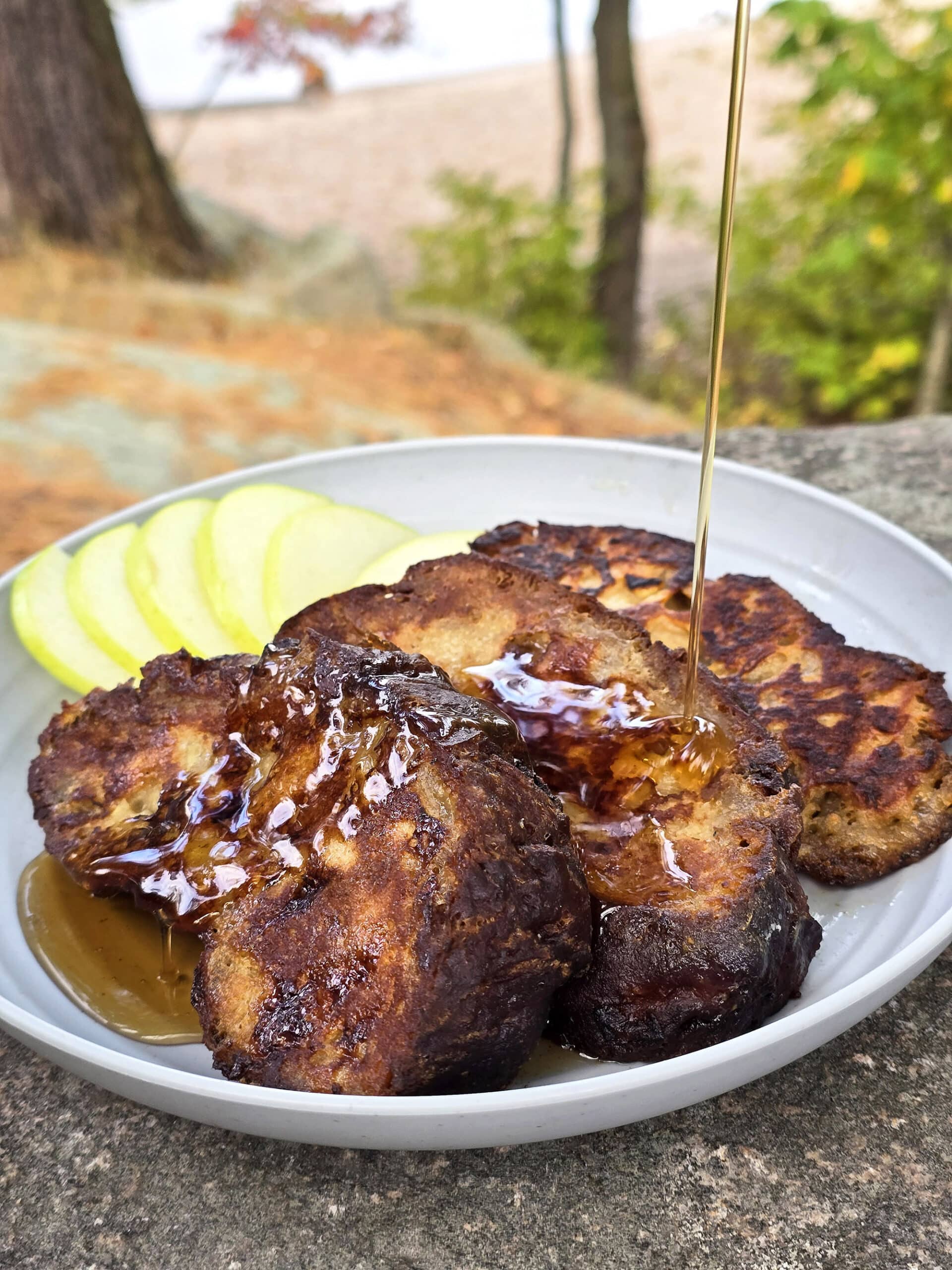 A plate of french toasted apple fritters.