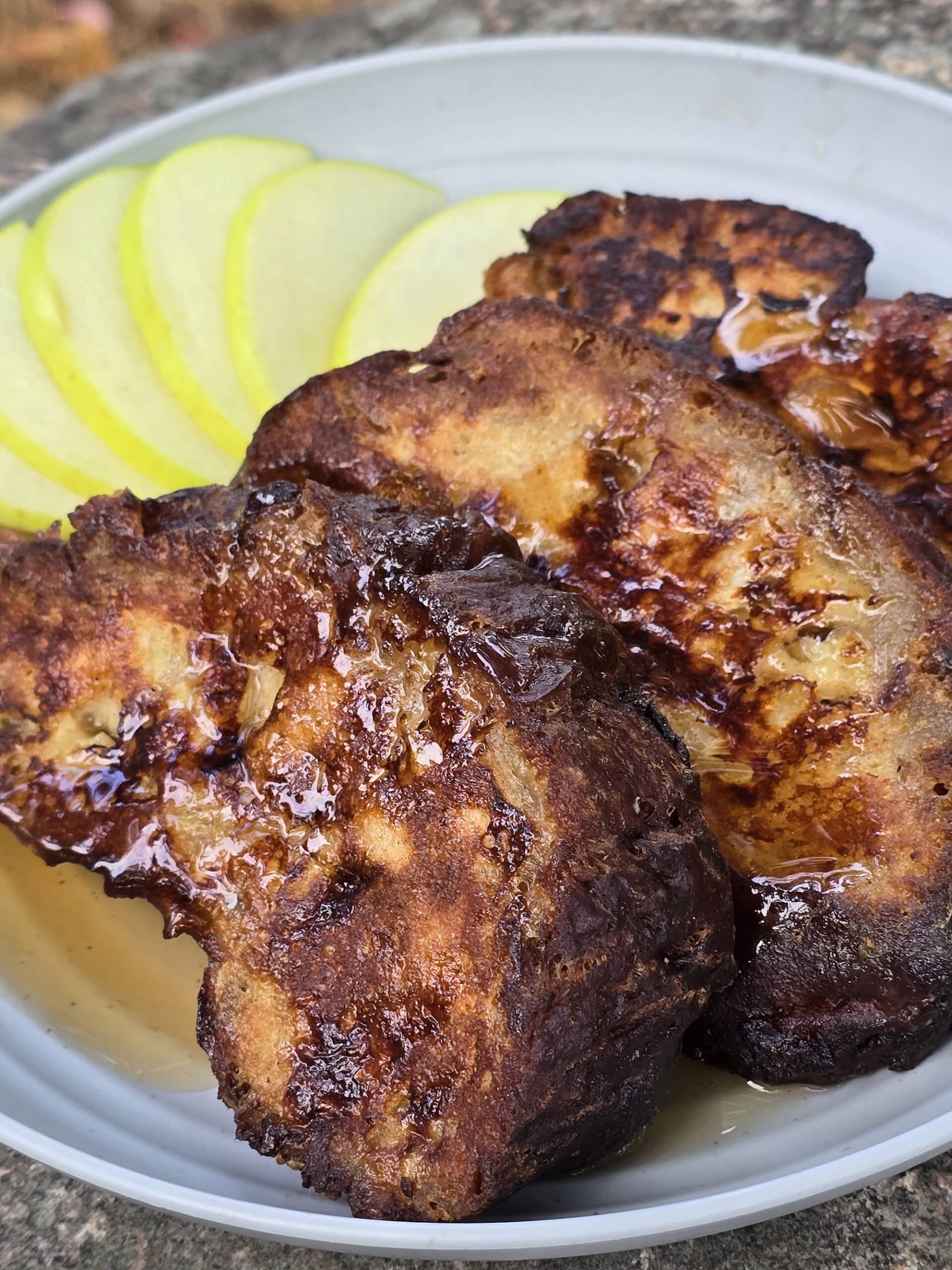 A plate of french toasted apple fritters.