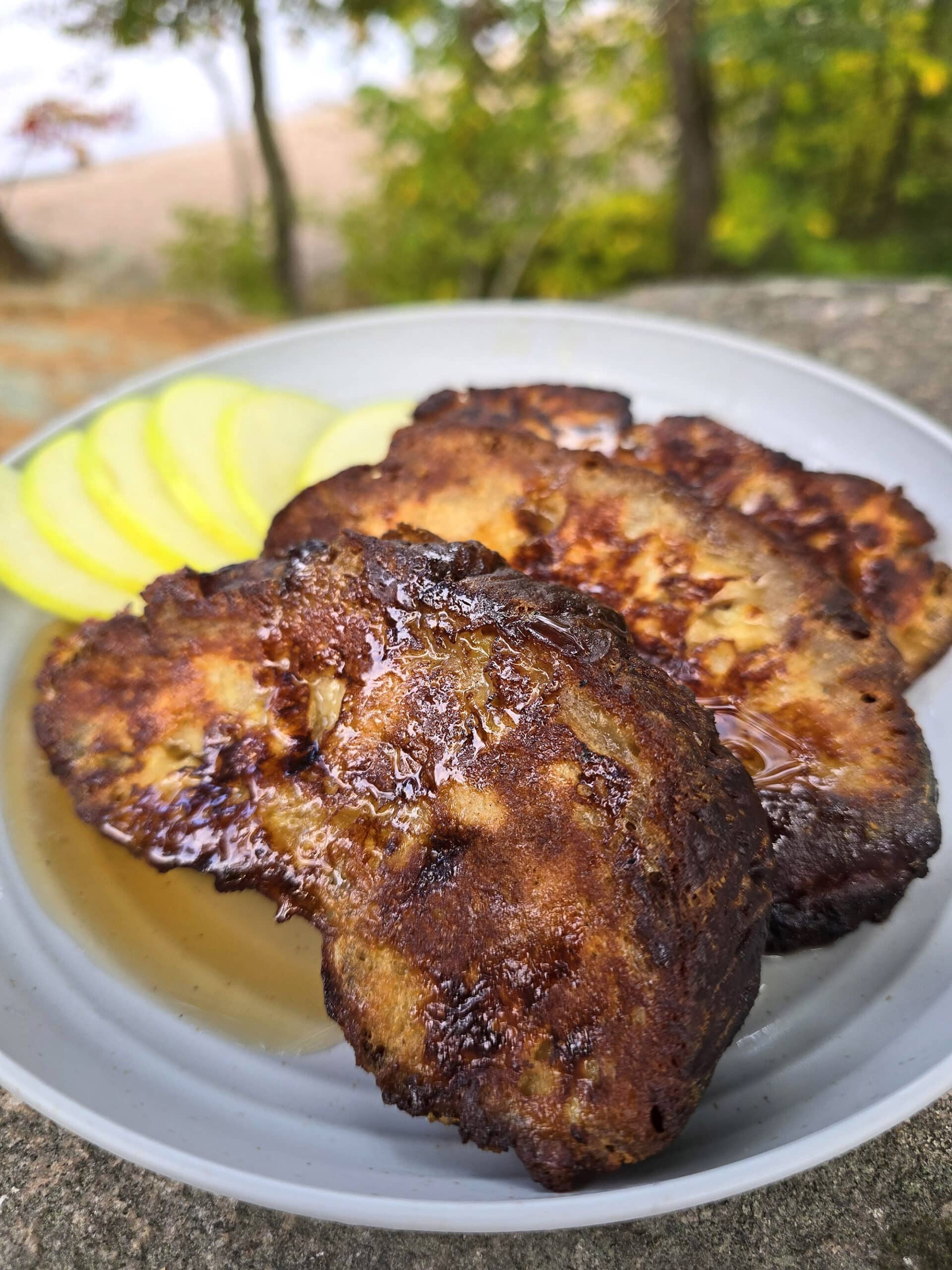 A plate of apple fritter french toast slices.