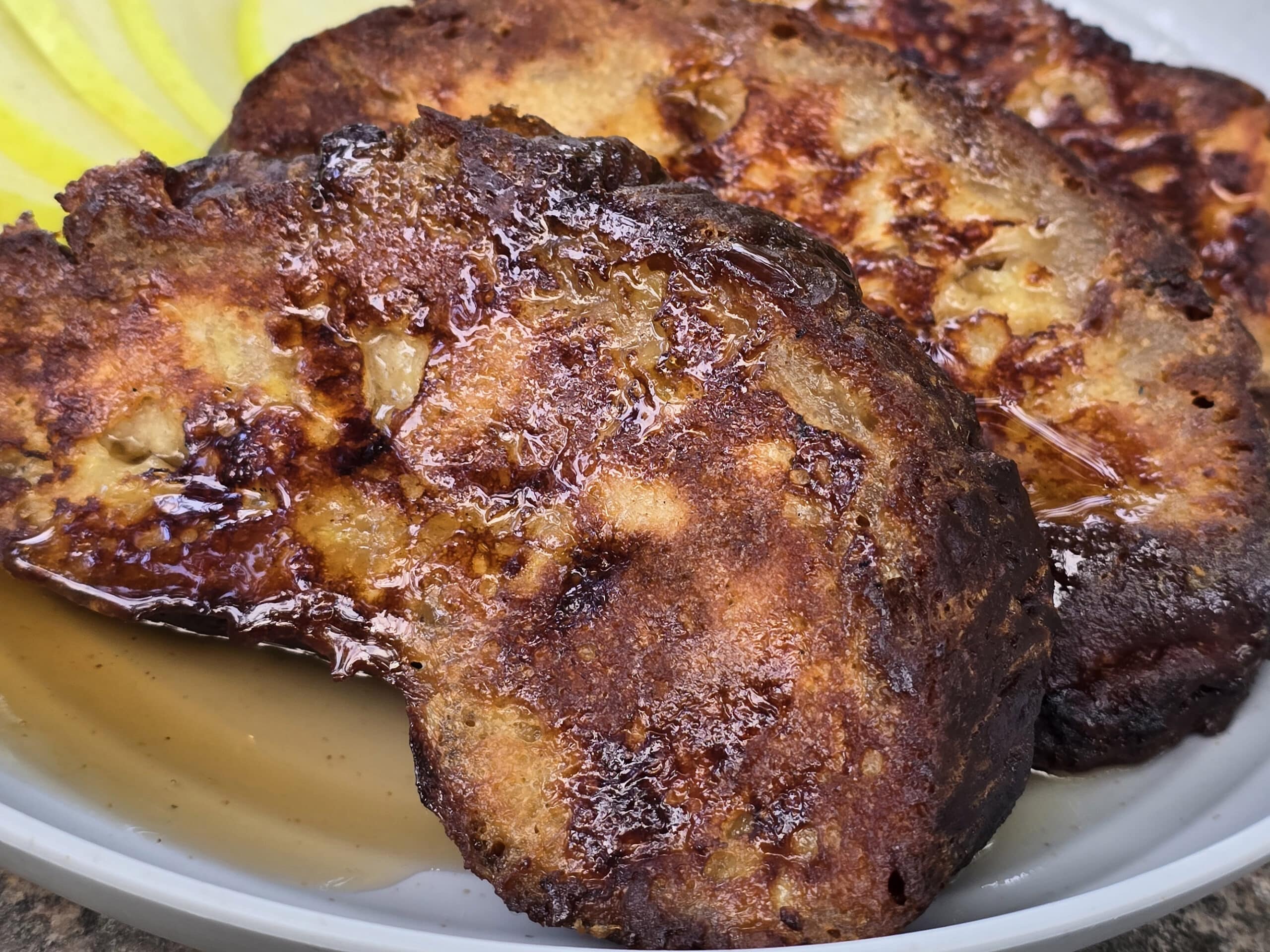 A plate of apple fritter french toast slices.