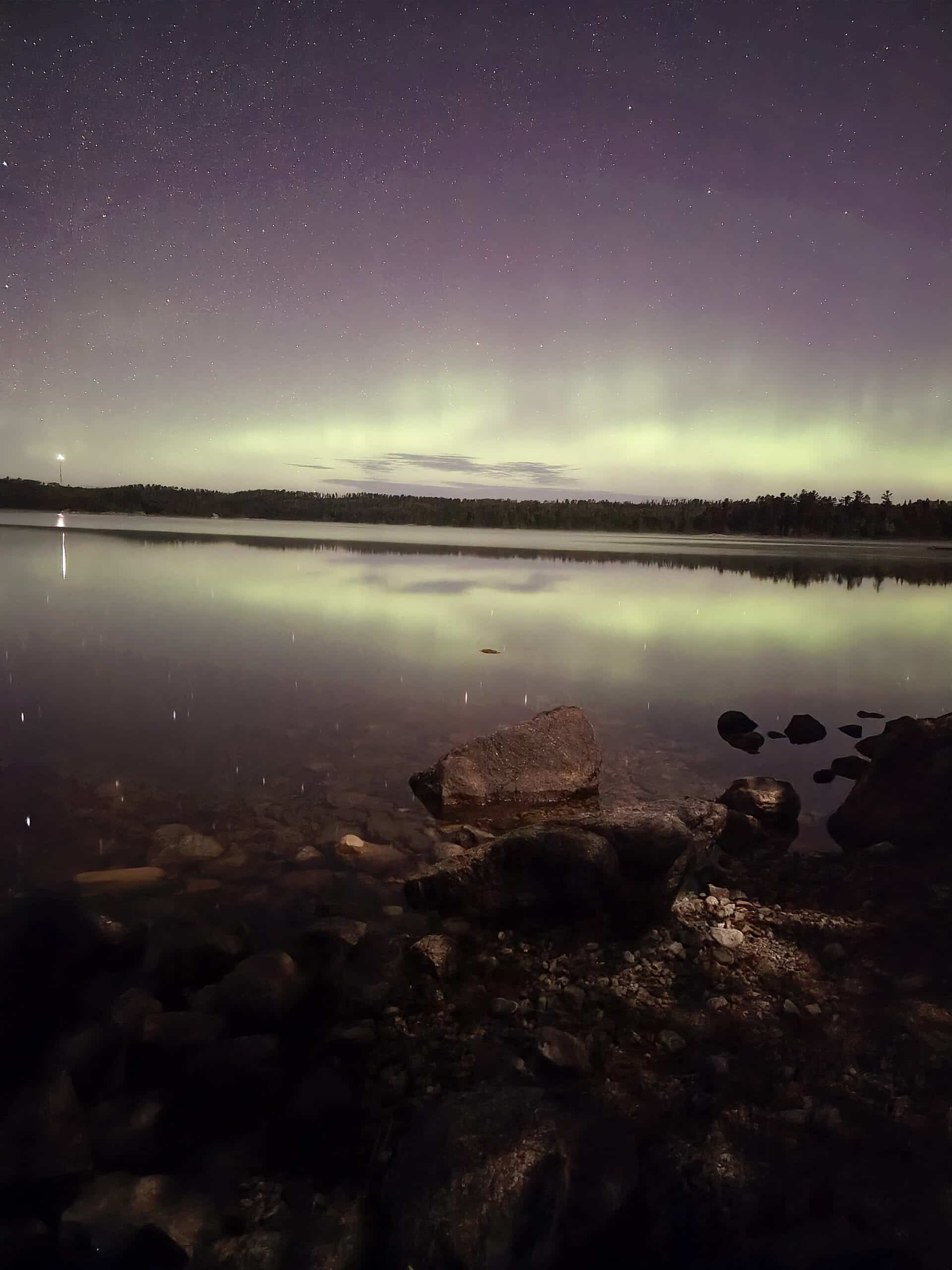 Bright pink aurora borealis display at quetico Provincial Park.