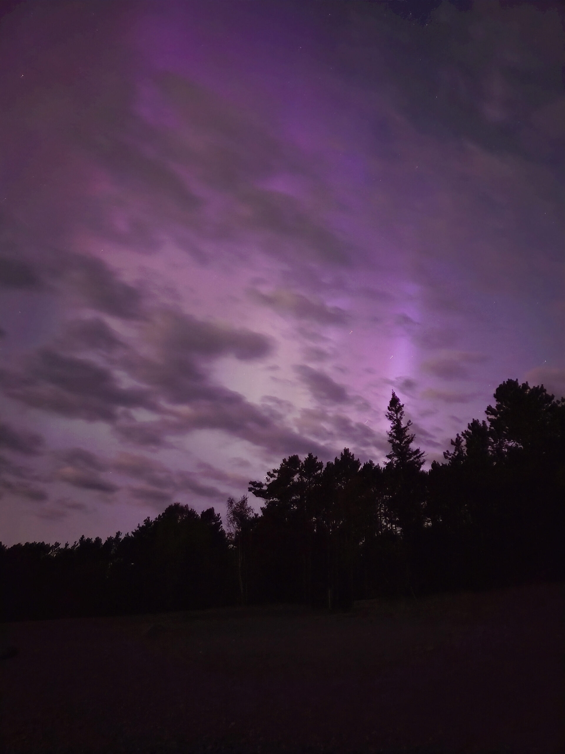 Bright pink aurora borealis display at -pancake bay Provincial Park.