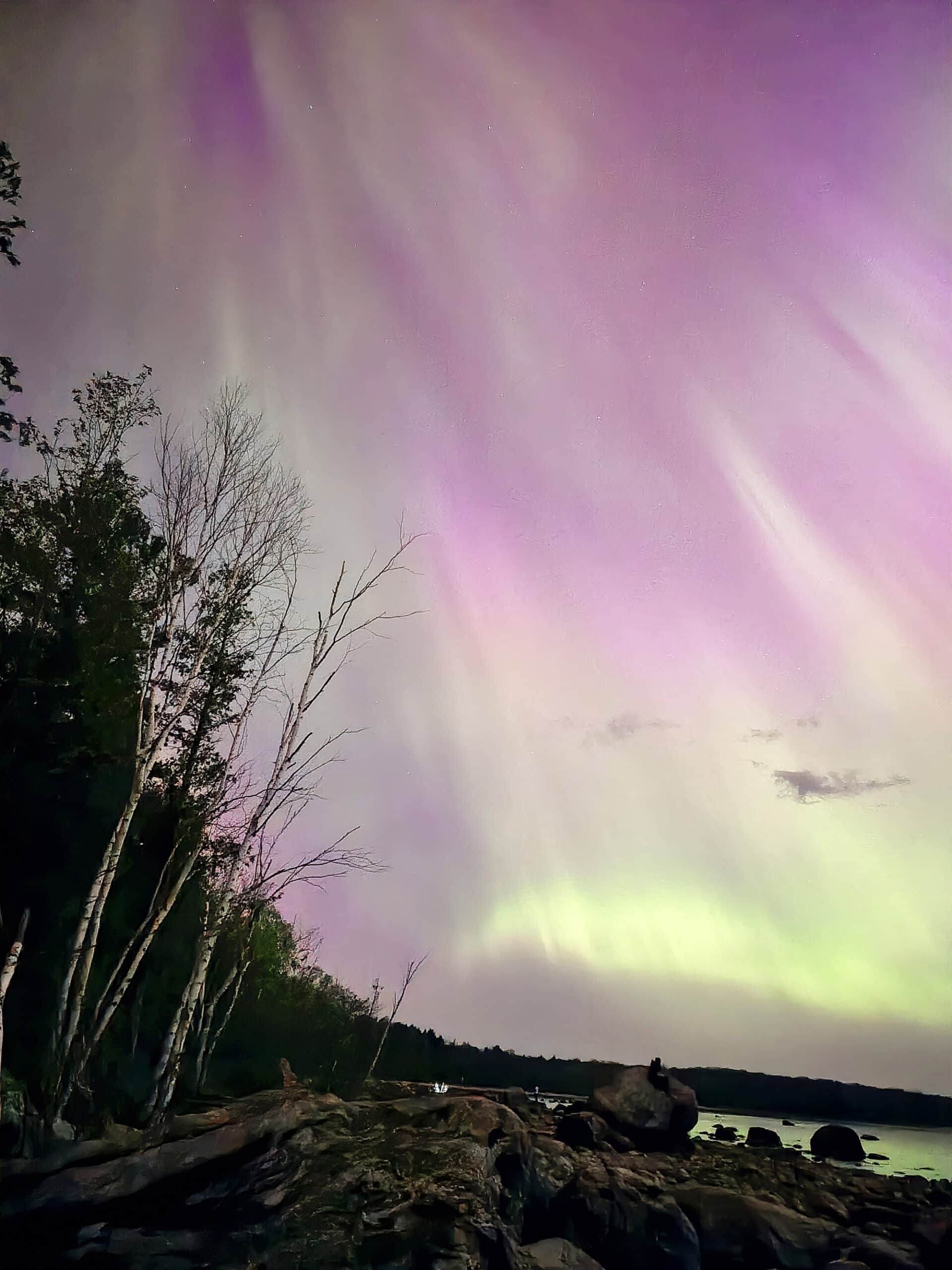 A bright pink and purple northern lights display in Ontario.