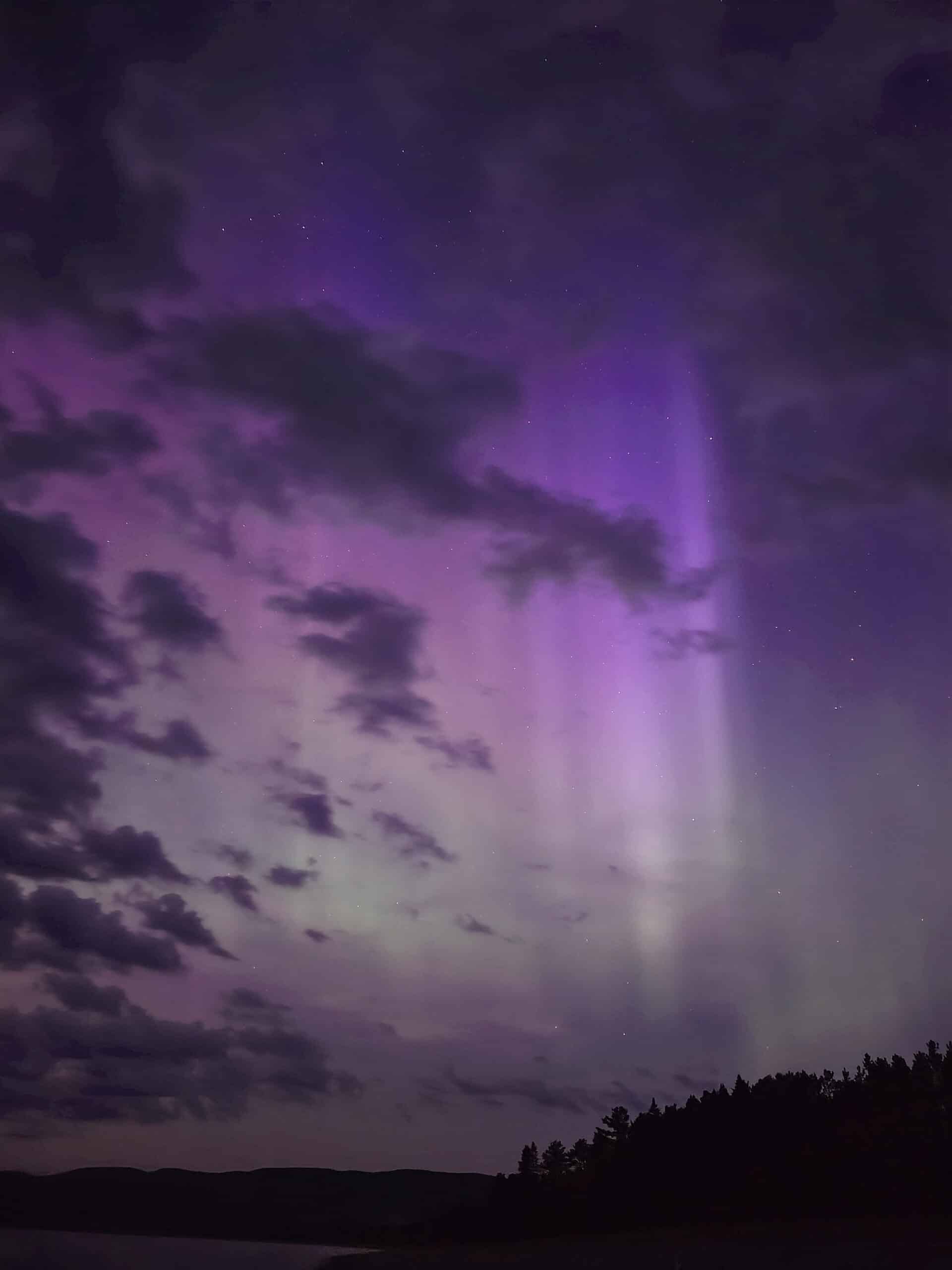 A bright pink and purple aurora borealis display in Ontario.