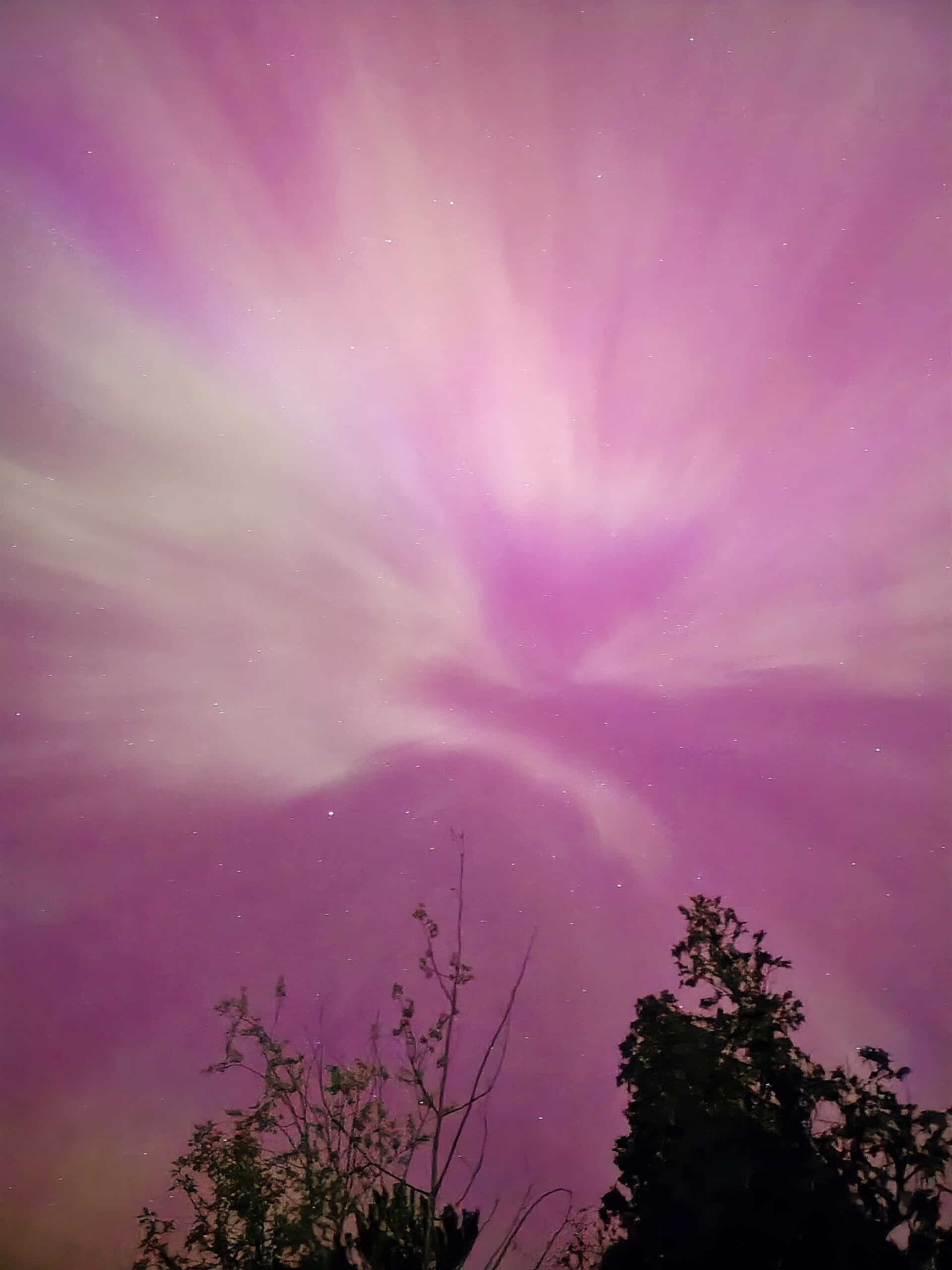 A bright pink northern lights display in Ontario.