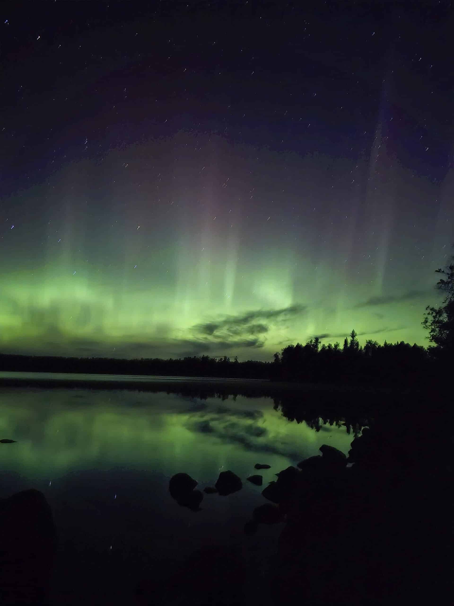 A bright green and purple aurora borealis display in Ontario.