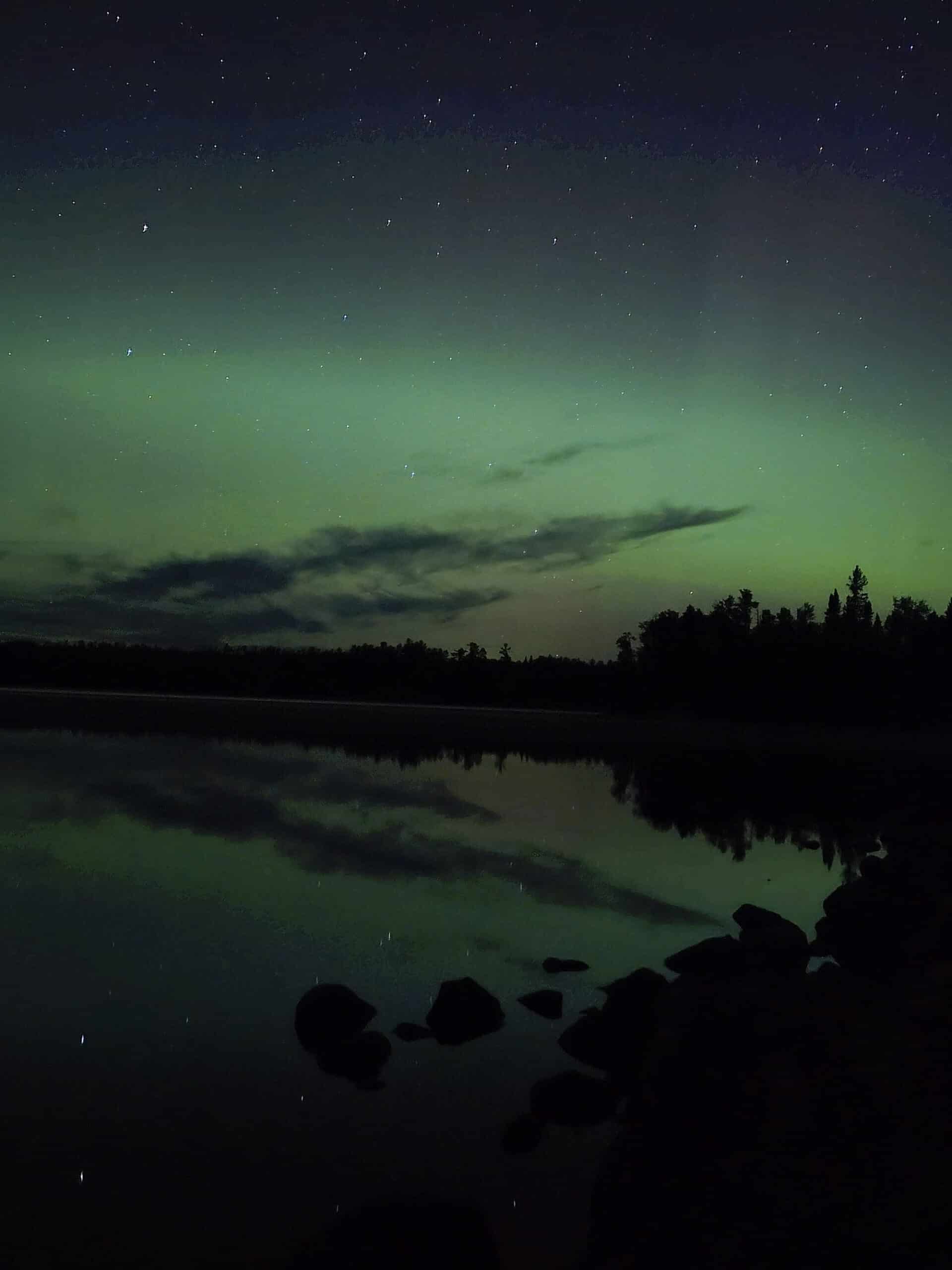 A bright green and blue northern lights display in Ontario.