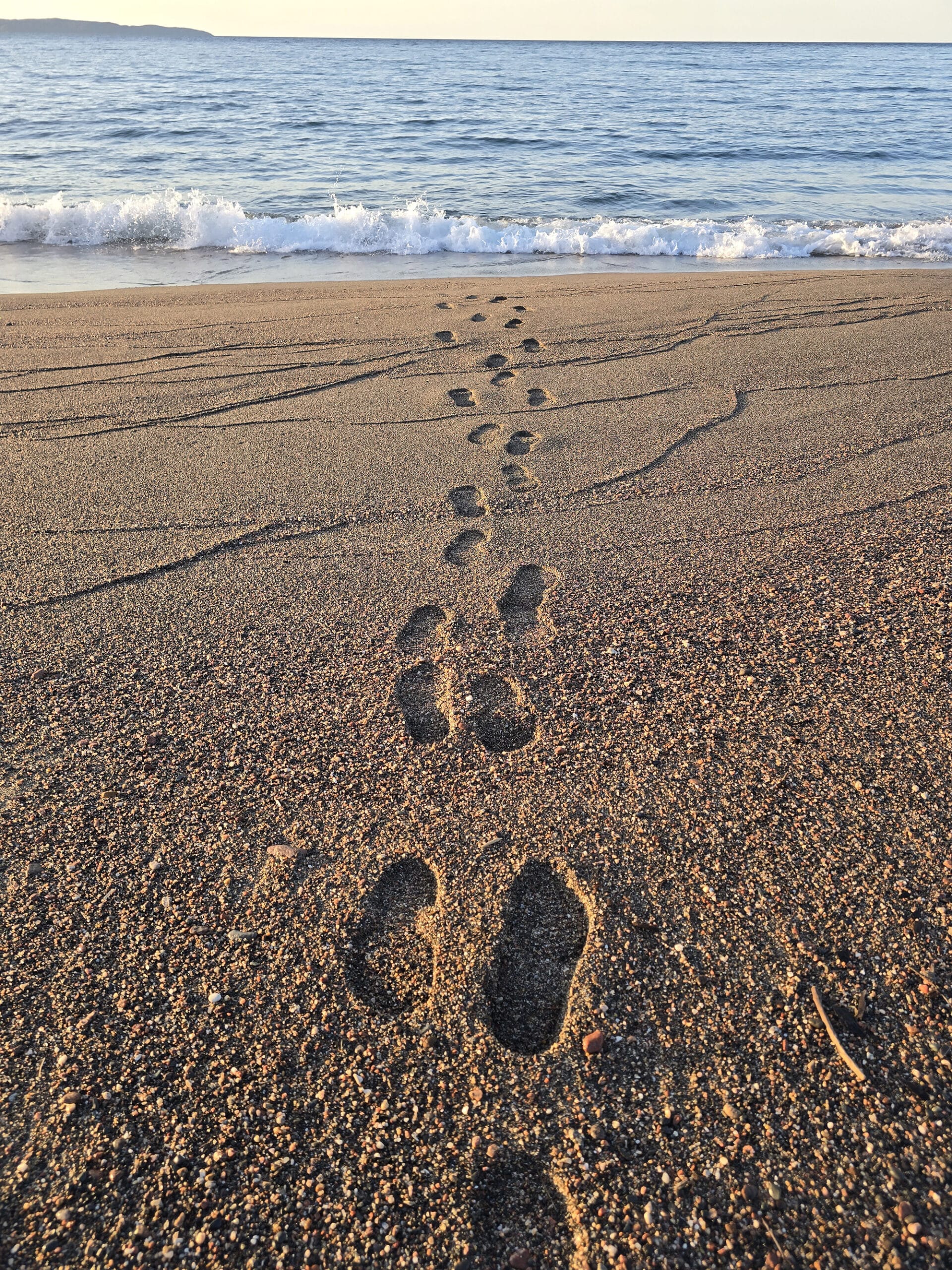 Footprints in the sand, walking to Lake Superior.