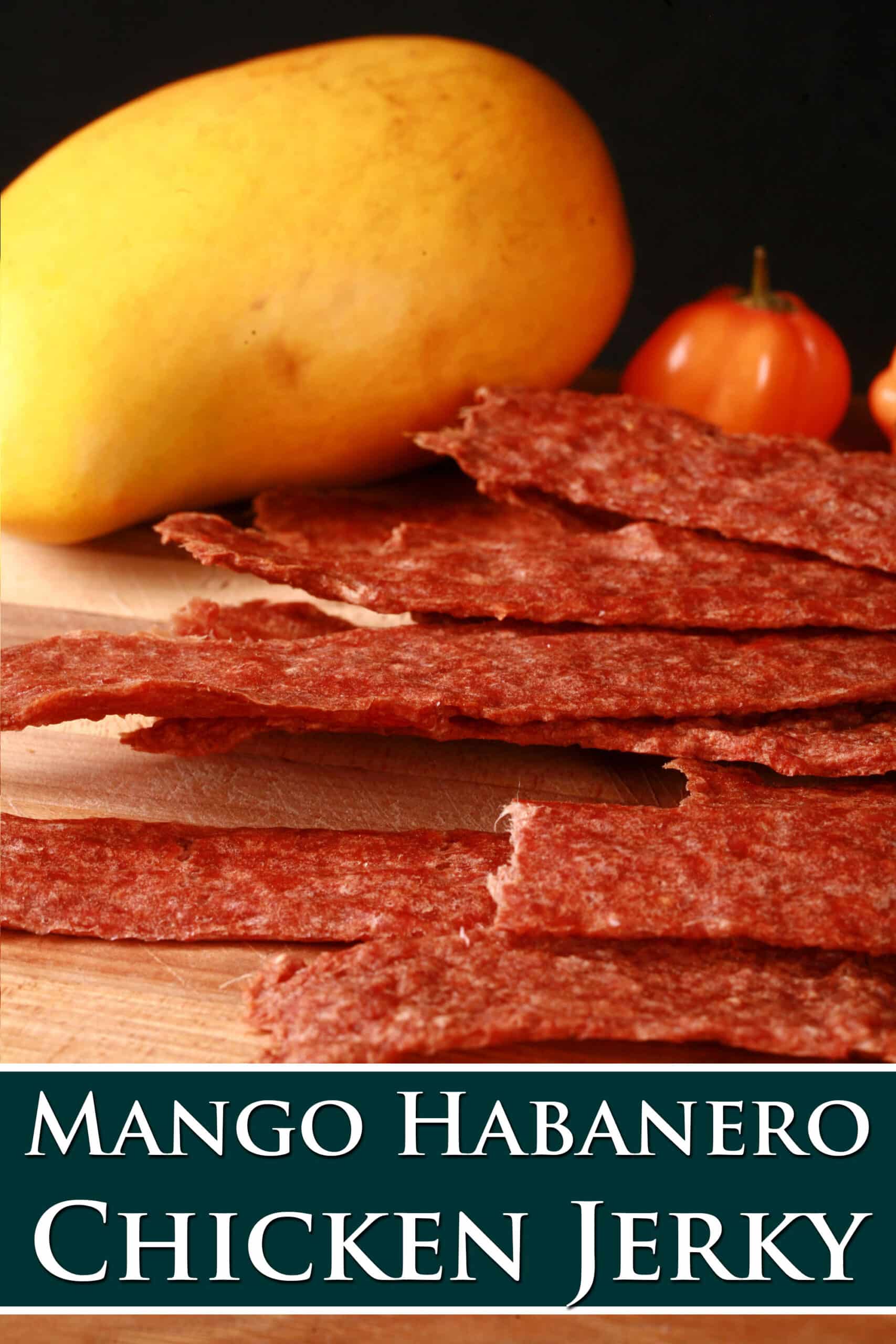 A pile of homemade chicken jerky on a cutting board. Overlaid text says mango habanero chicken jerky.