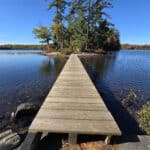 A boardwalk extends out to a small island on hardy lake.