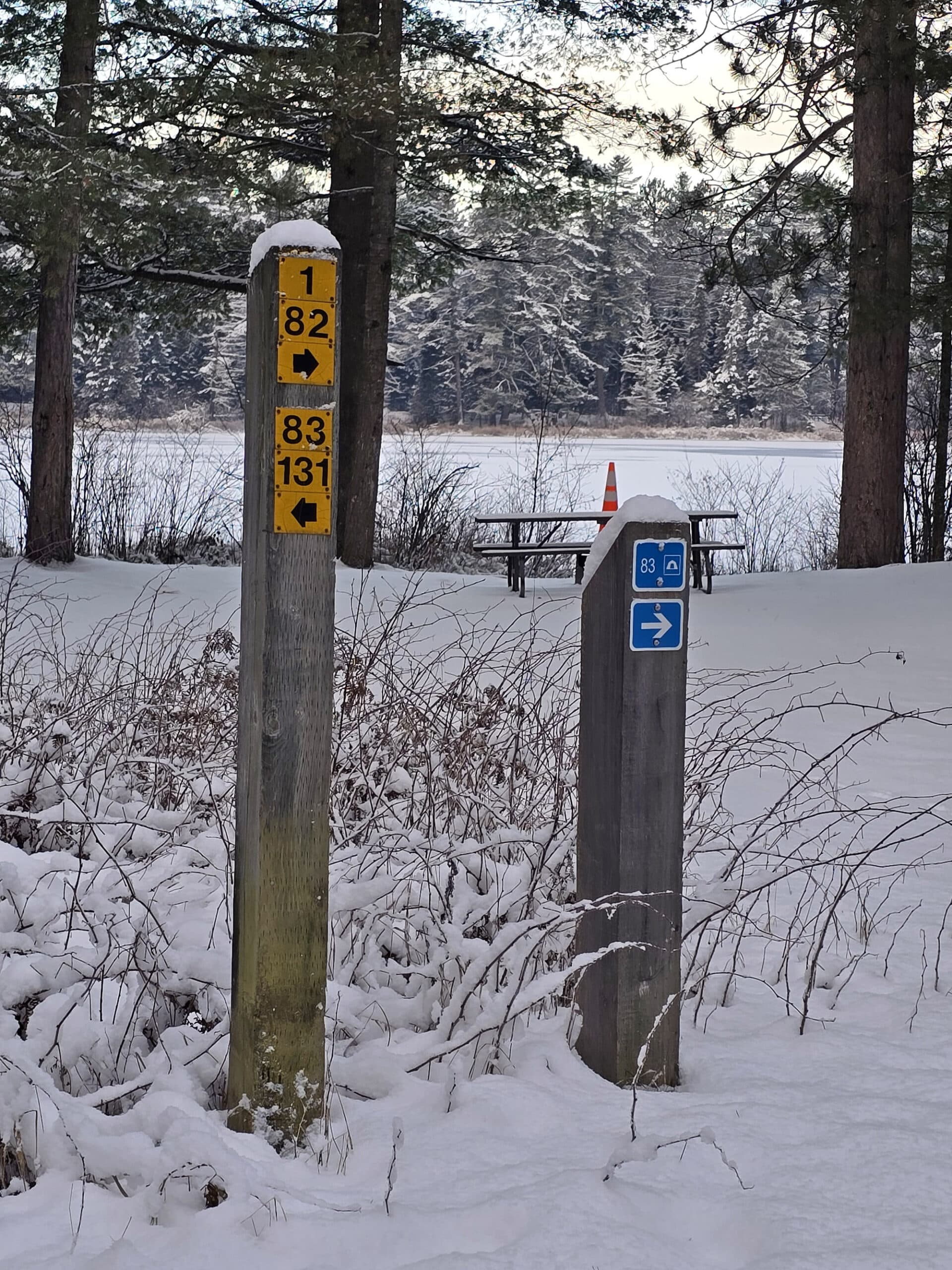 2 directional signs for Mew Lake campground.