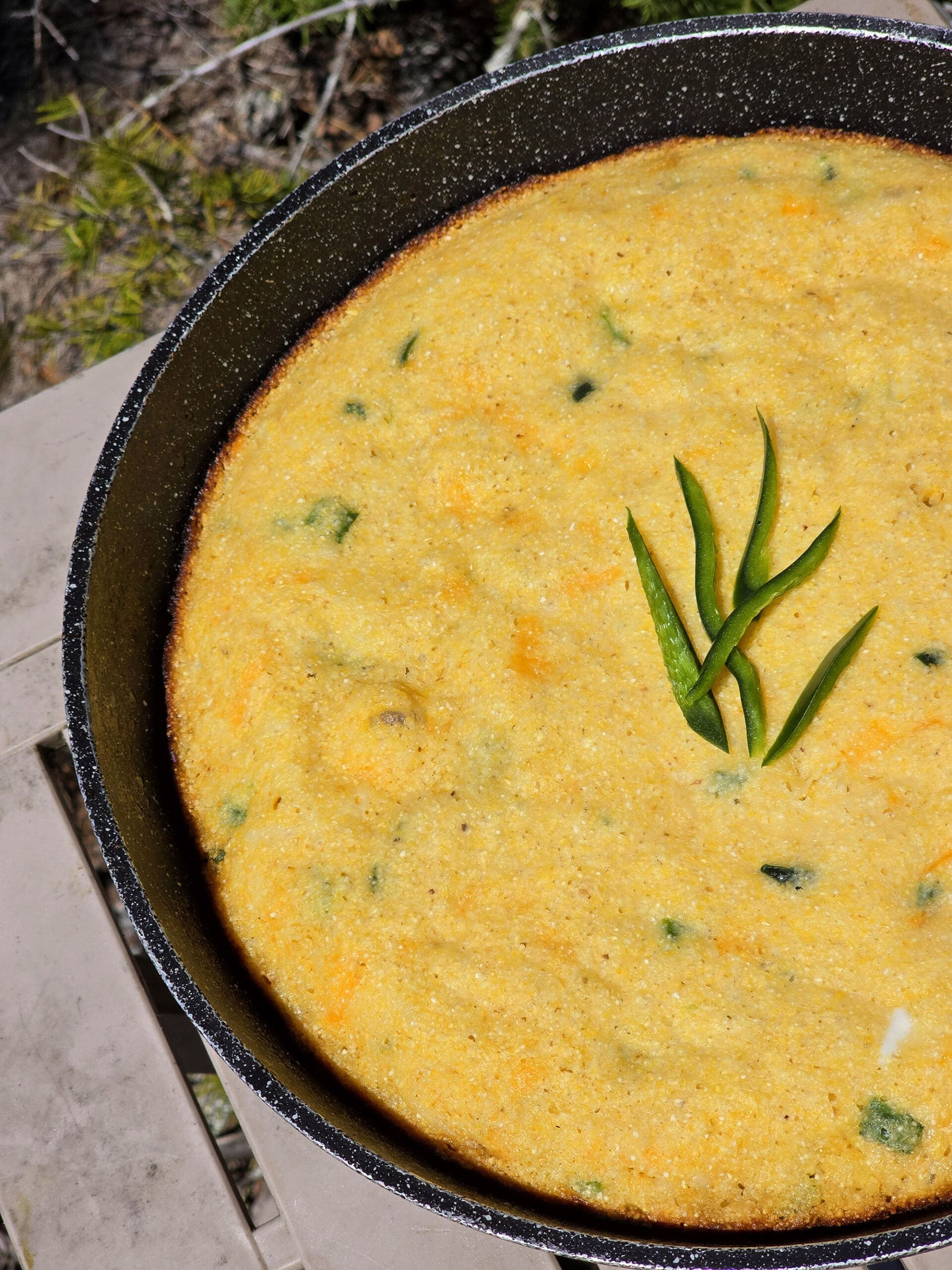 A pan of skillet cheddar jalapeno cornbread.