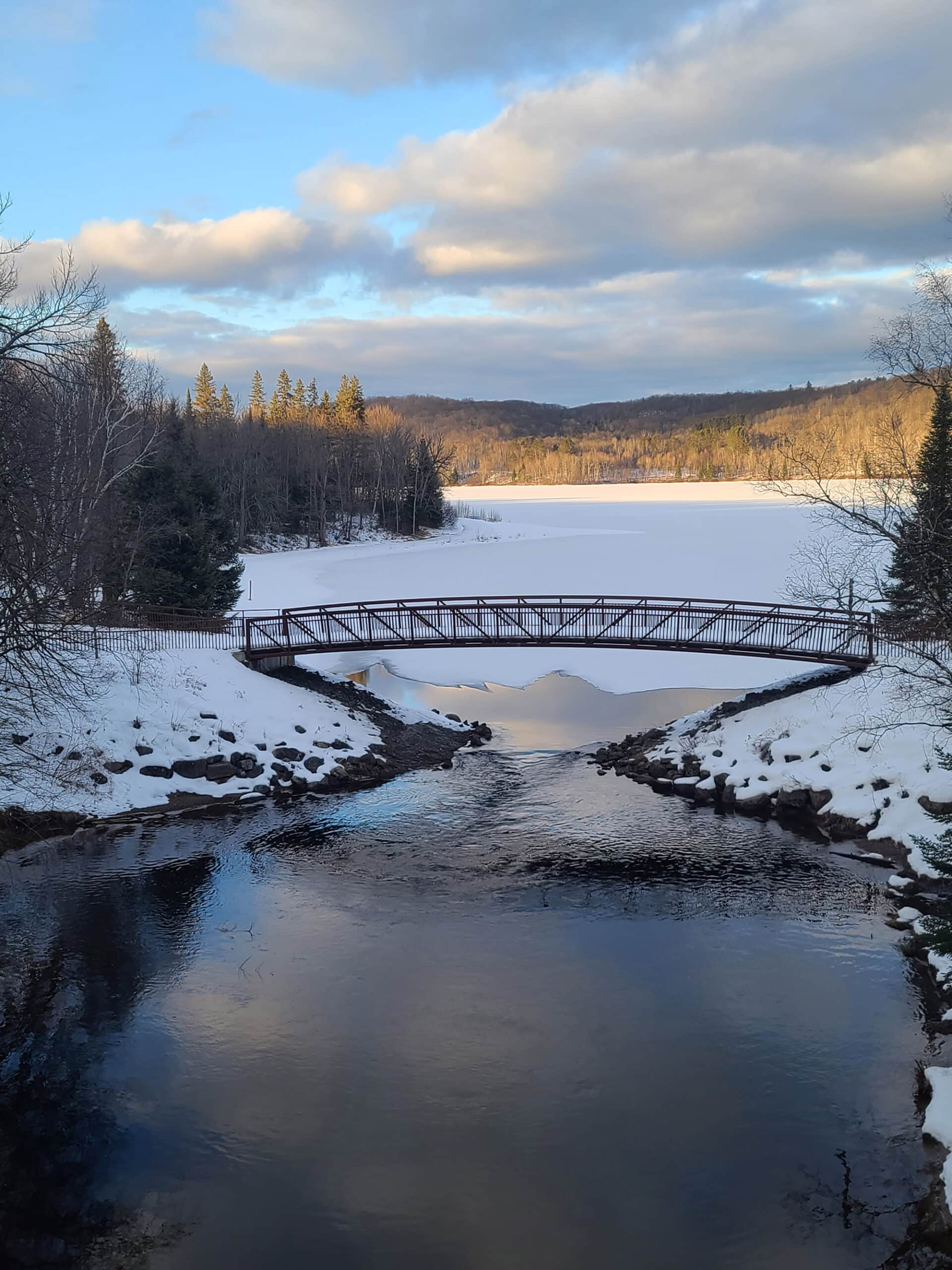 A winter view over arrowhead lake and a bridge.