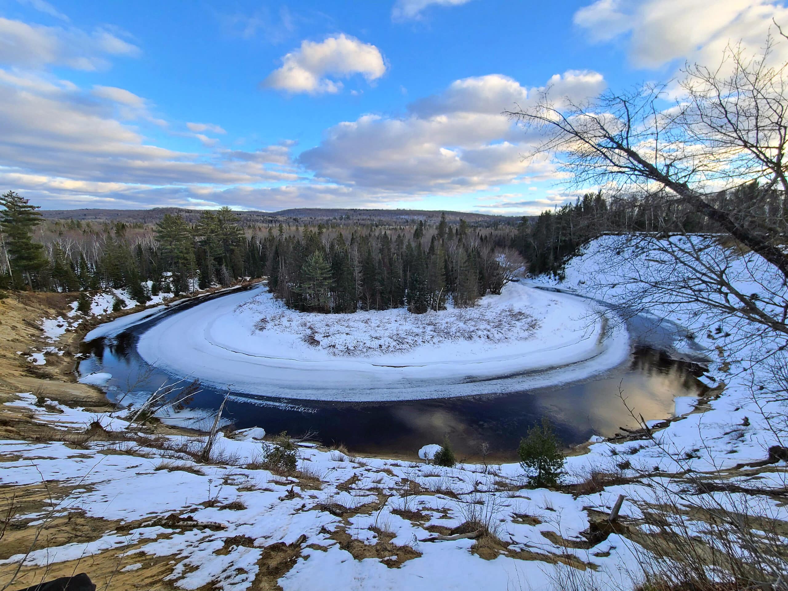 A ring shaped body of water in winter - big bend lookout at arrowhead provincial park.