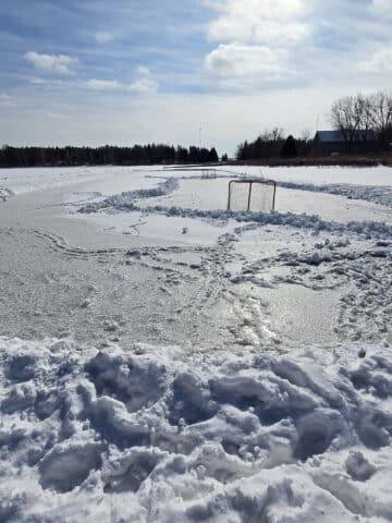 A skating rink cleared on valens lake, on a sunny day.