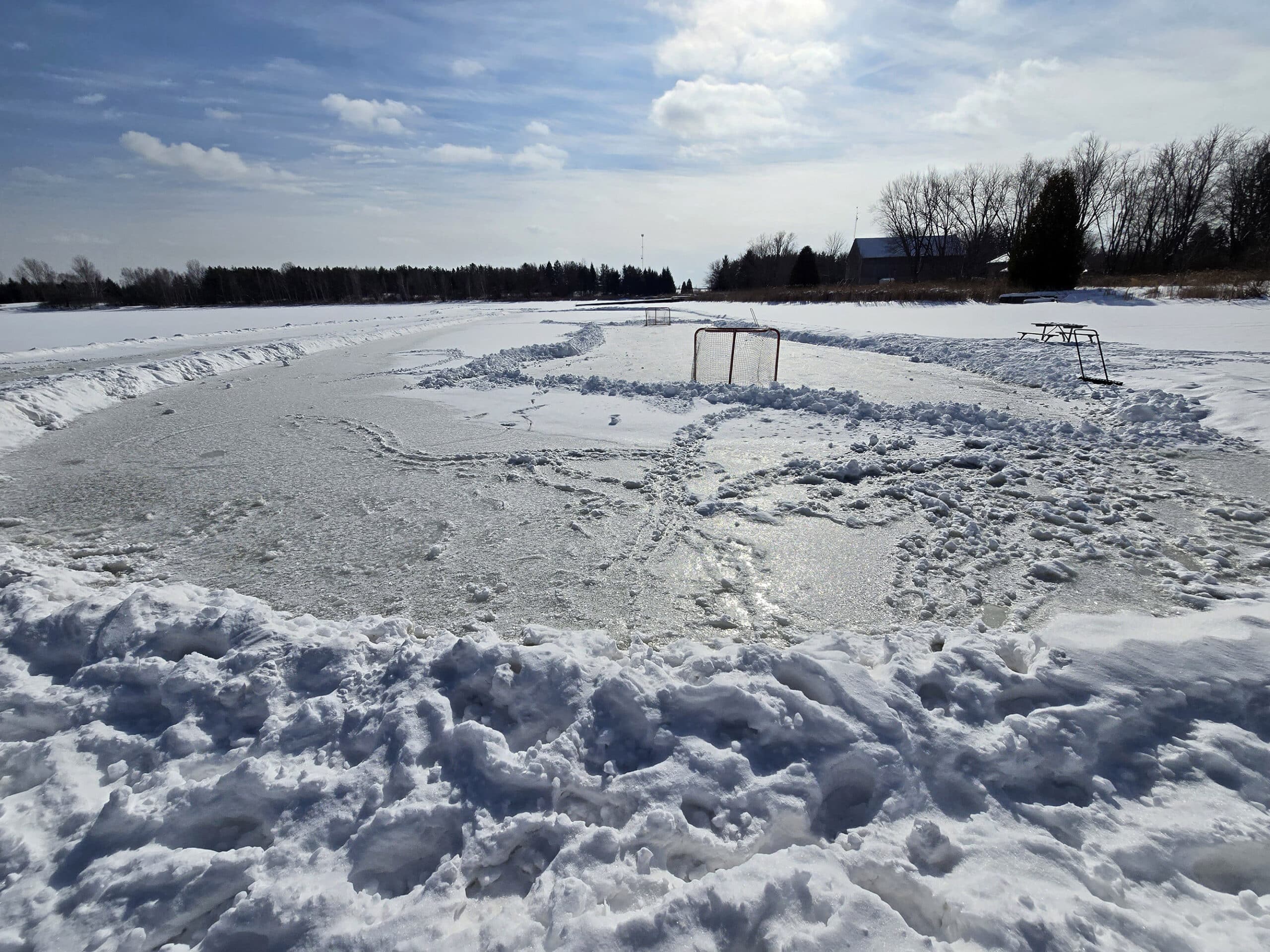 A skating rink cleared on valens lake, on a sunny day.