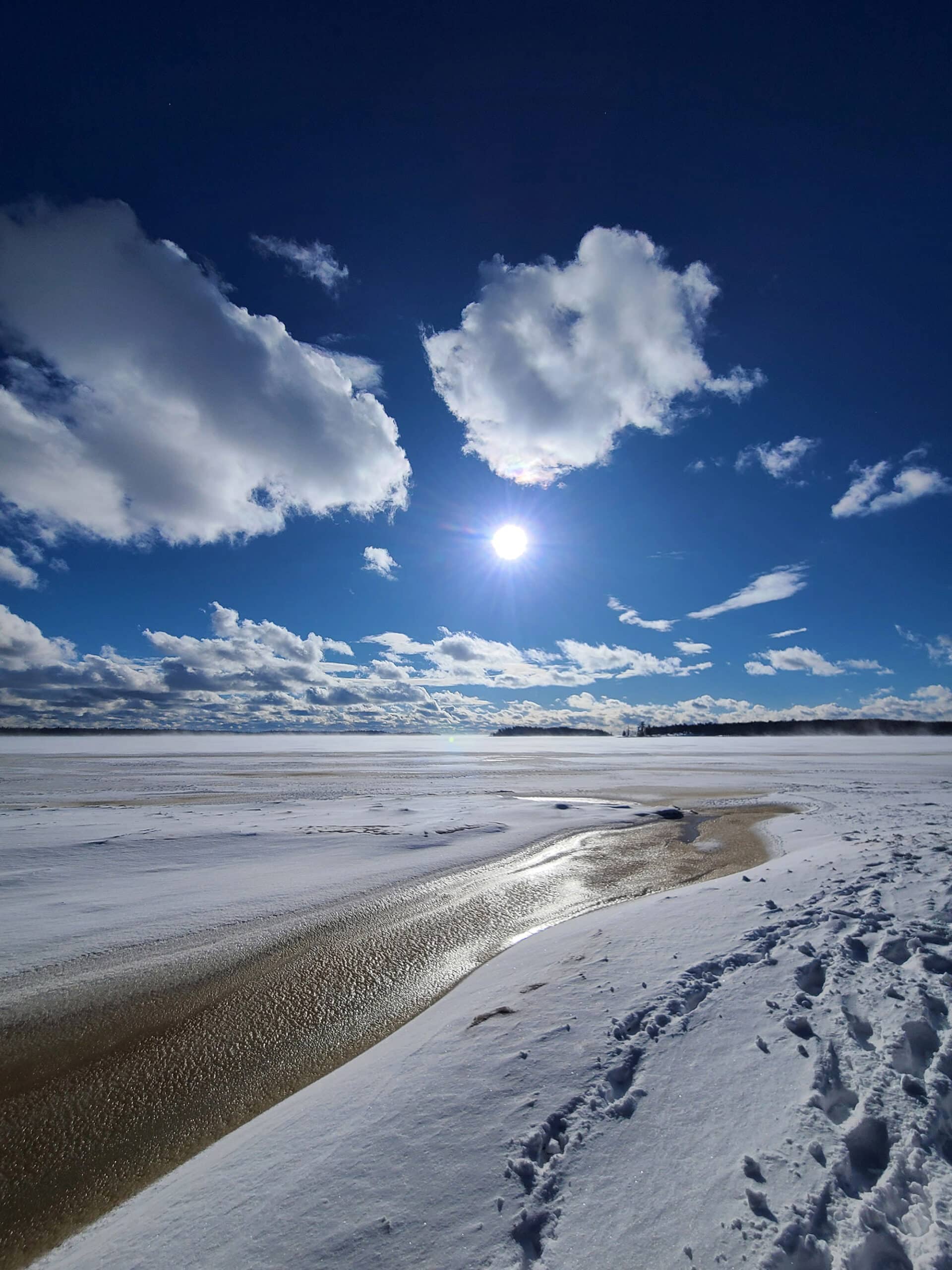 Half frozen Georgian Bay on a sunny winter day.