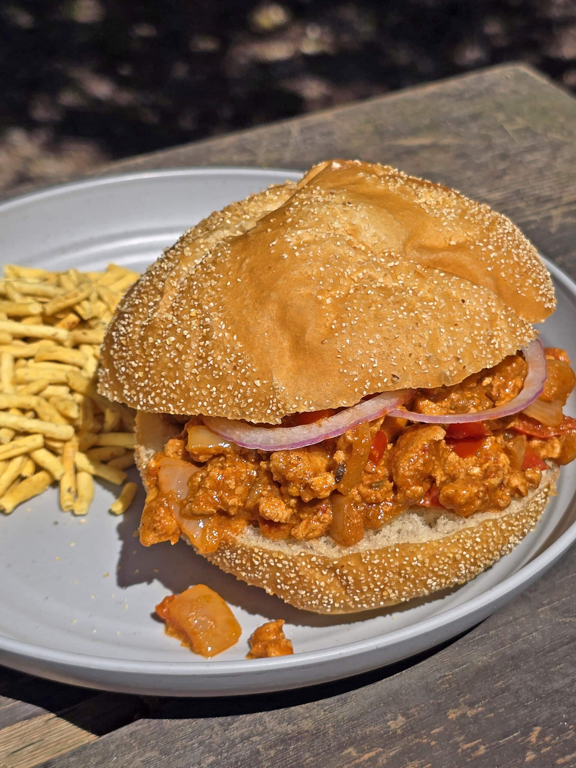 An Indian sloppy joes sandwich on a plate.