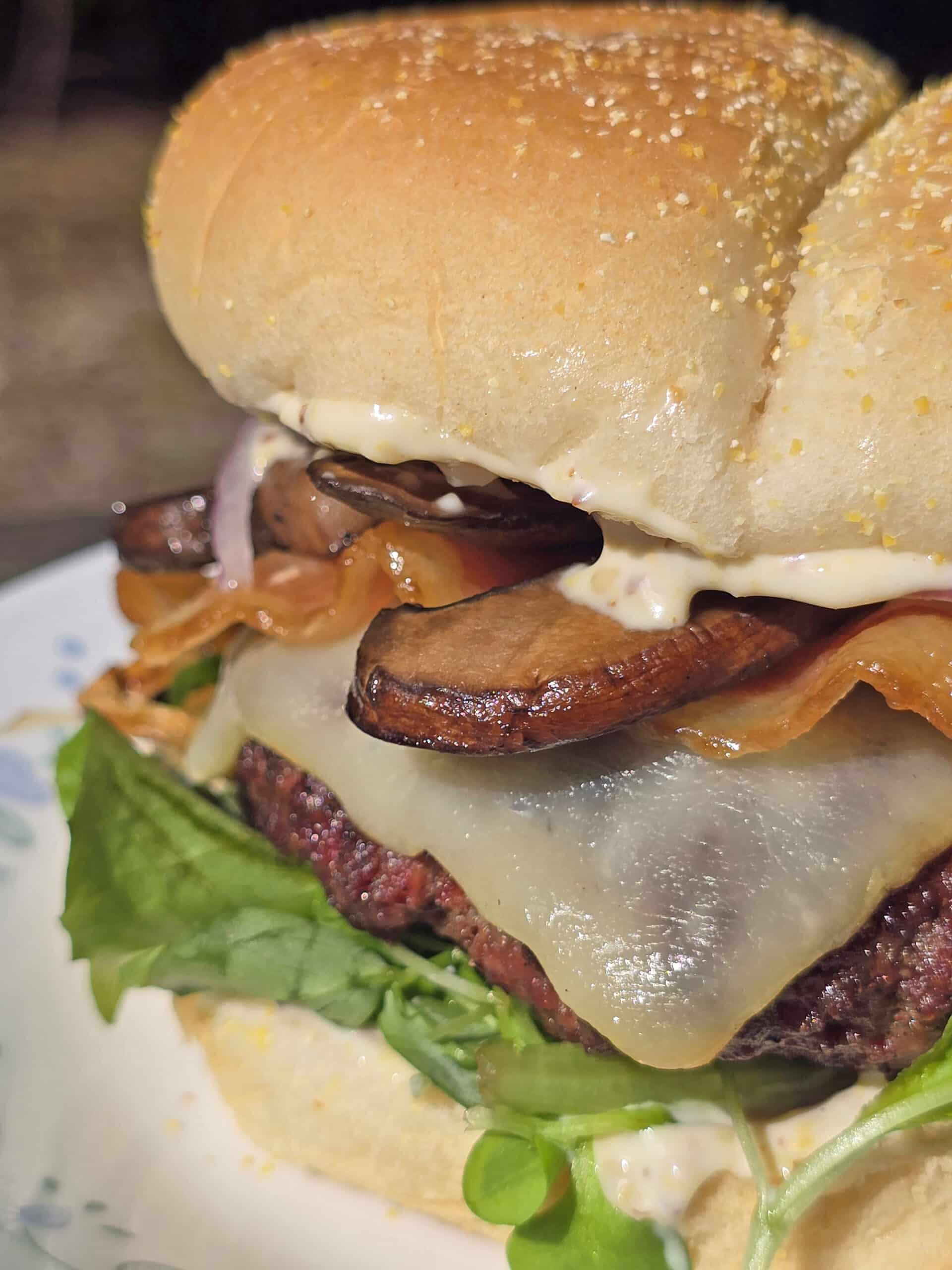 A juicy elk burger with bacon, smoked cheddar, sauteed mushrooms, and dijonnaise.