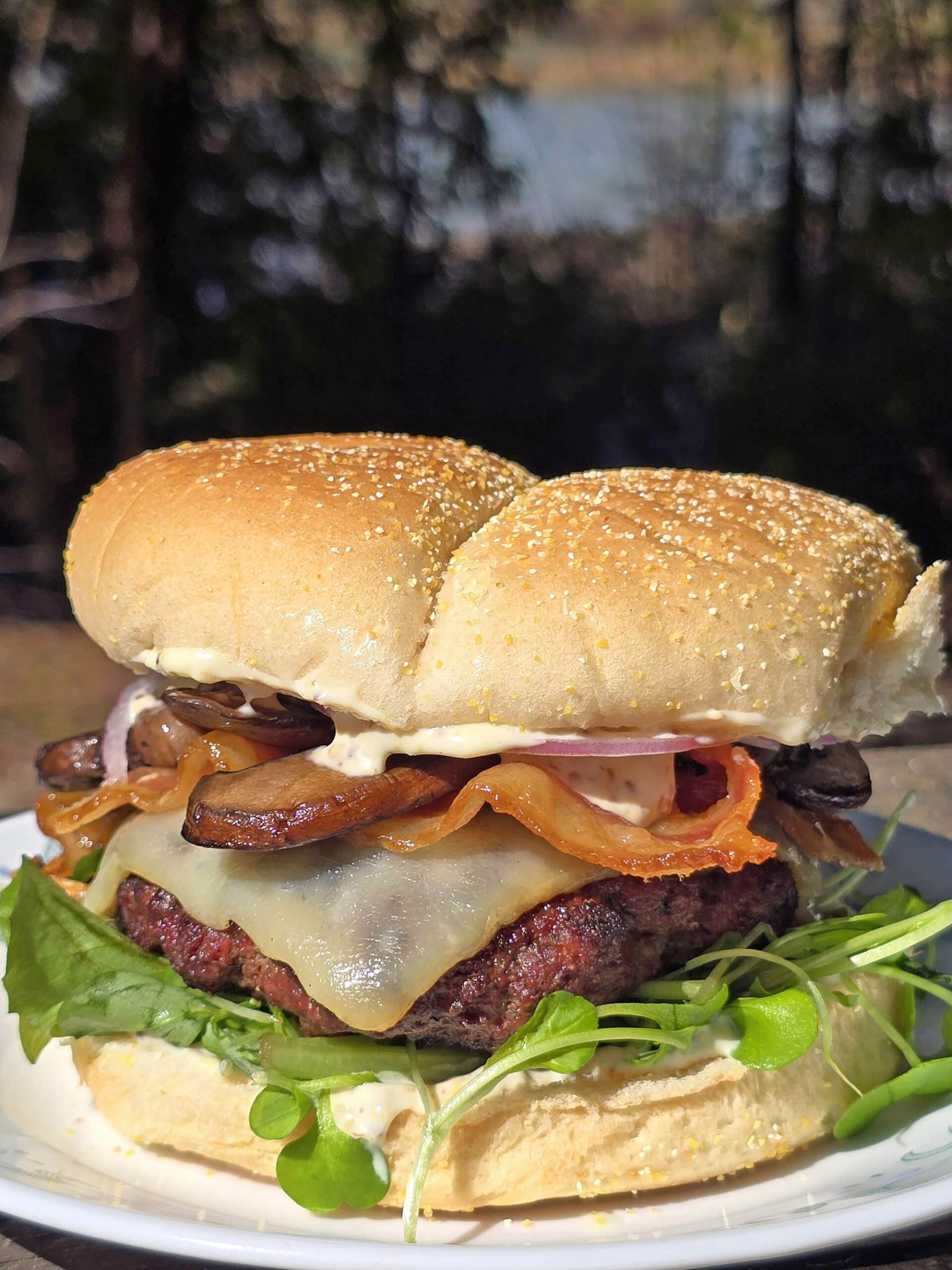 A juicy elk burger with bacon, smoked cheddar, sauteed mushrooms, and dijonnaise.