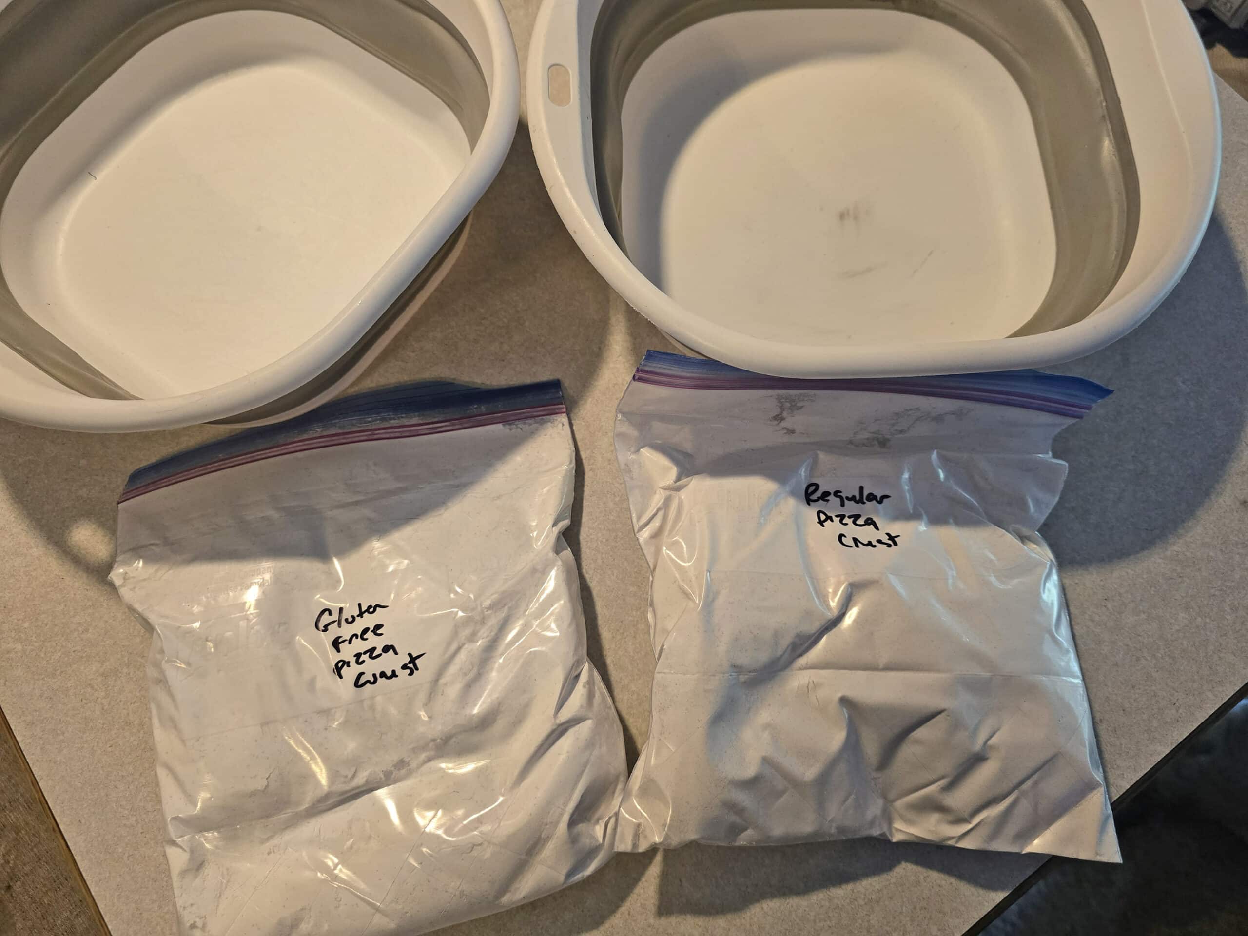 2 bags of pizza dough mix, one labelled gluten free pizza dough mix.