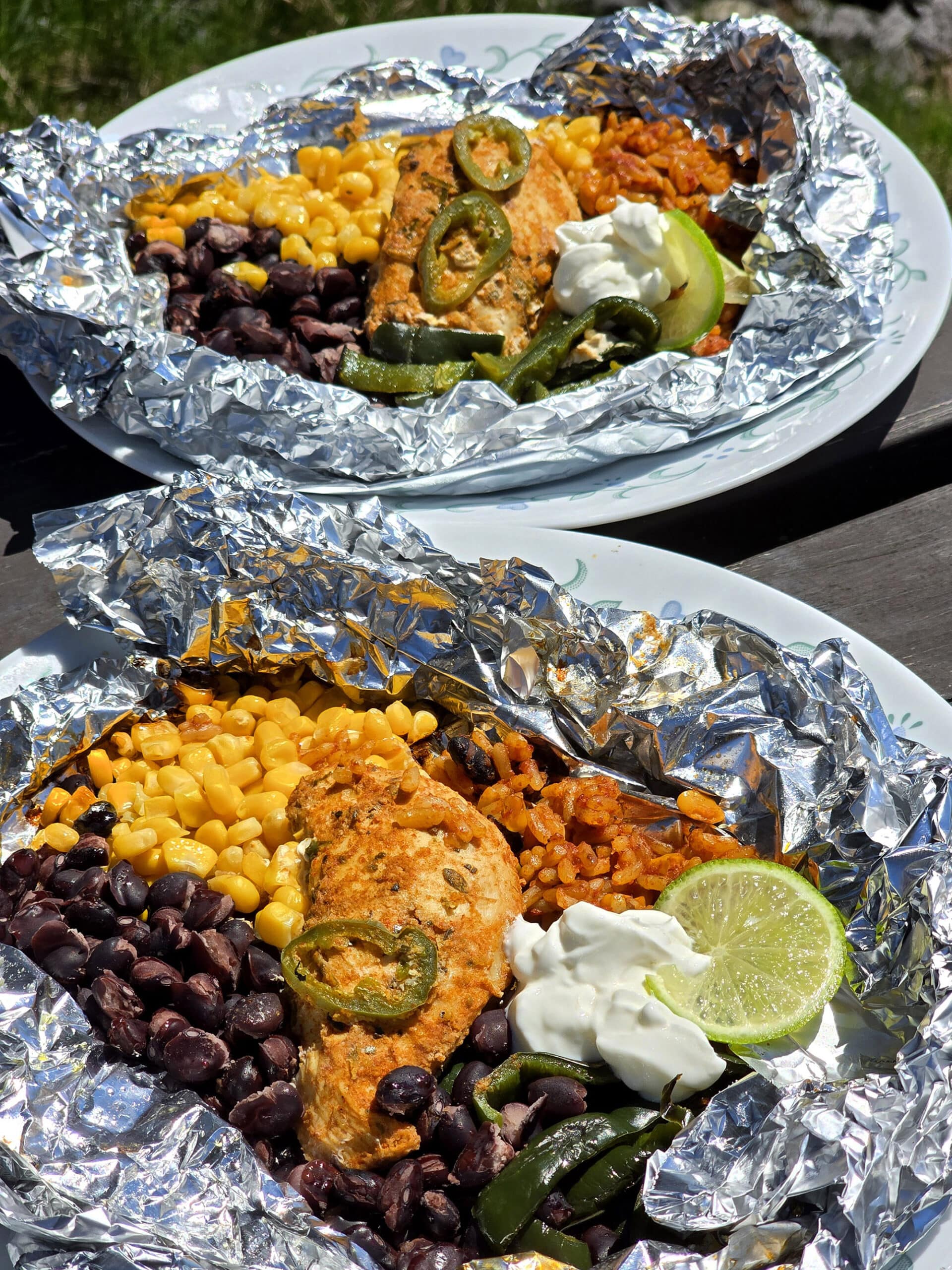 A Southwestern Chicken foil packet, with Southwest marinated chicken, black beans, corn, Mexican rice, and poblano peppers.