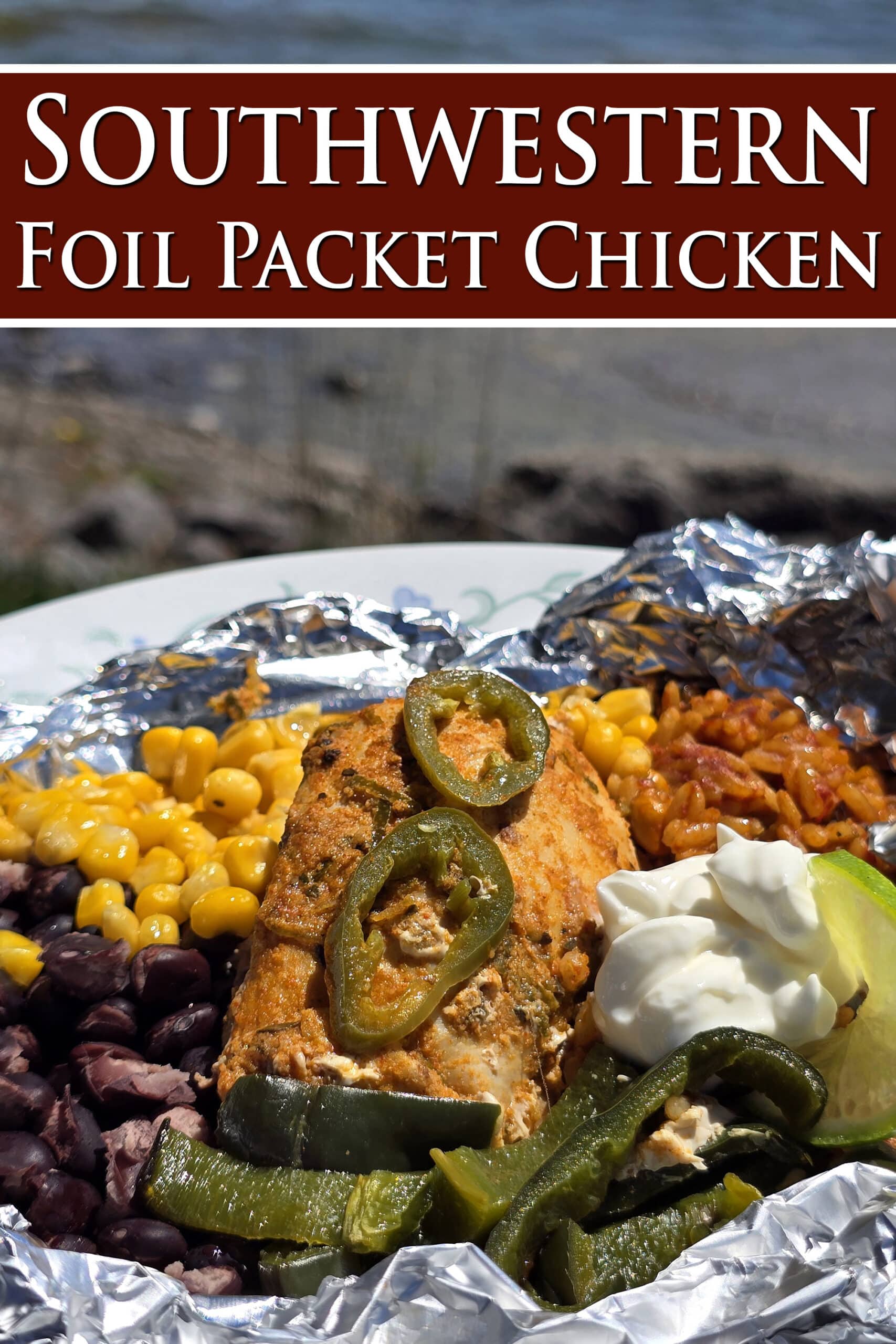 A Southwest Chicken foil packet, with Southwest marinated chicken, black beans, corn, Mexican rice, and poblano peppers.  Overlaid text says southwestern foil packet chicken.