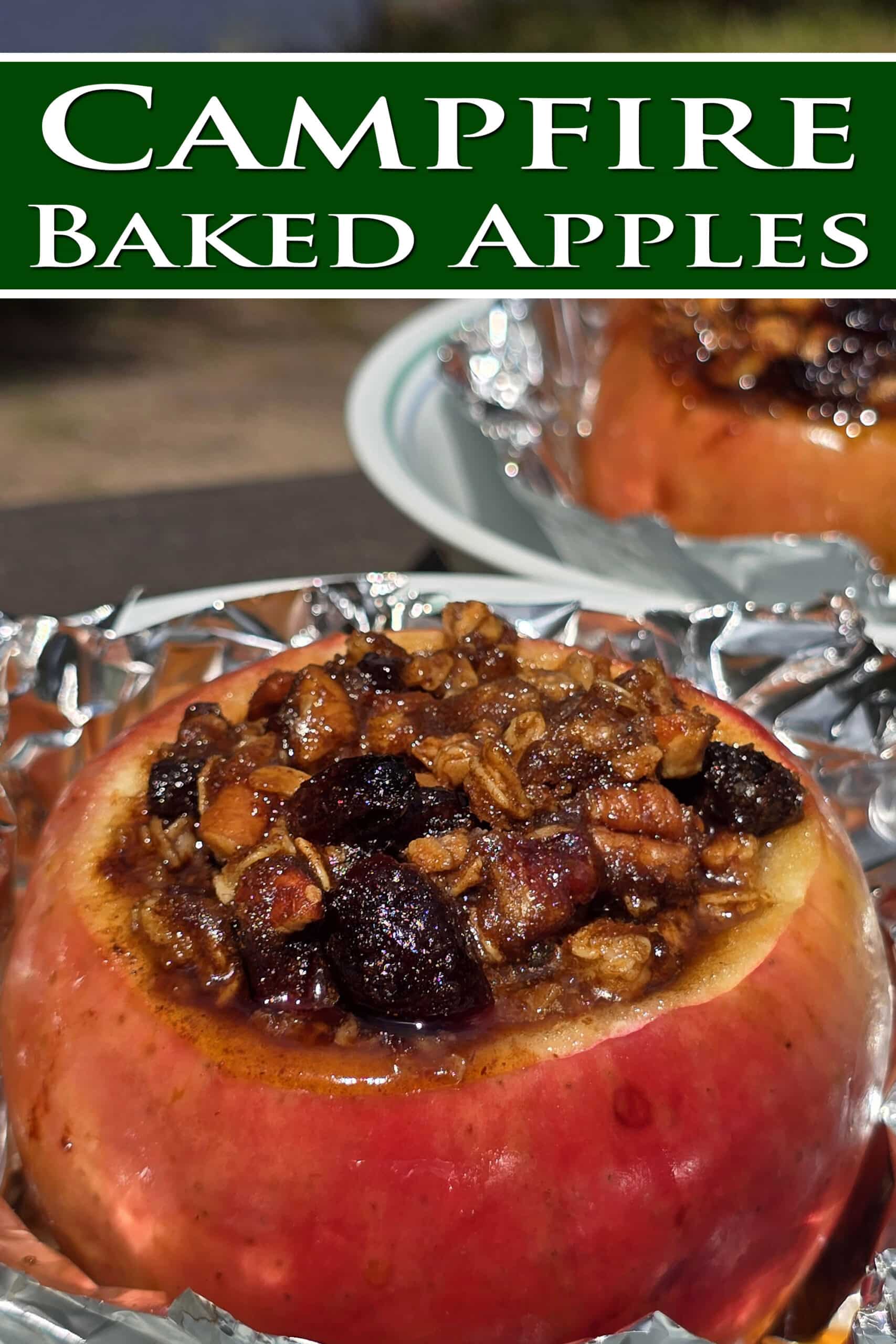 A large baked apple in foil, stuffed with granola, raisins, brown sugar, nuts, and cinnamon. Overlaid text says campfire baked apples.