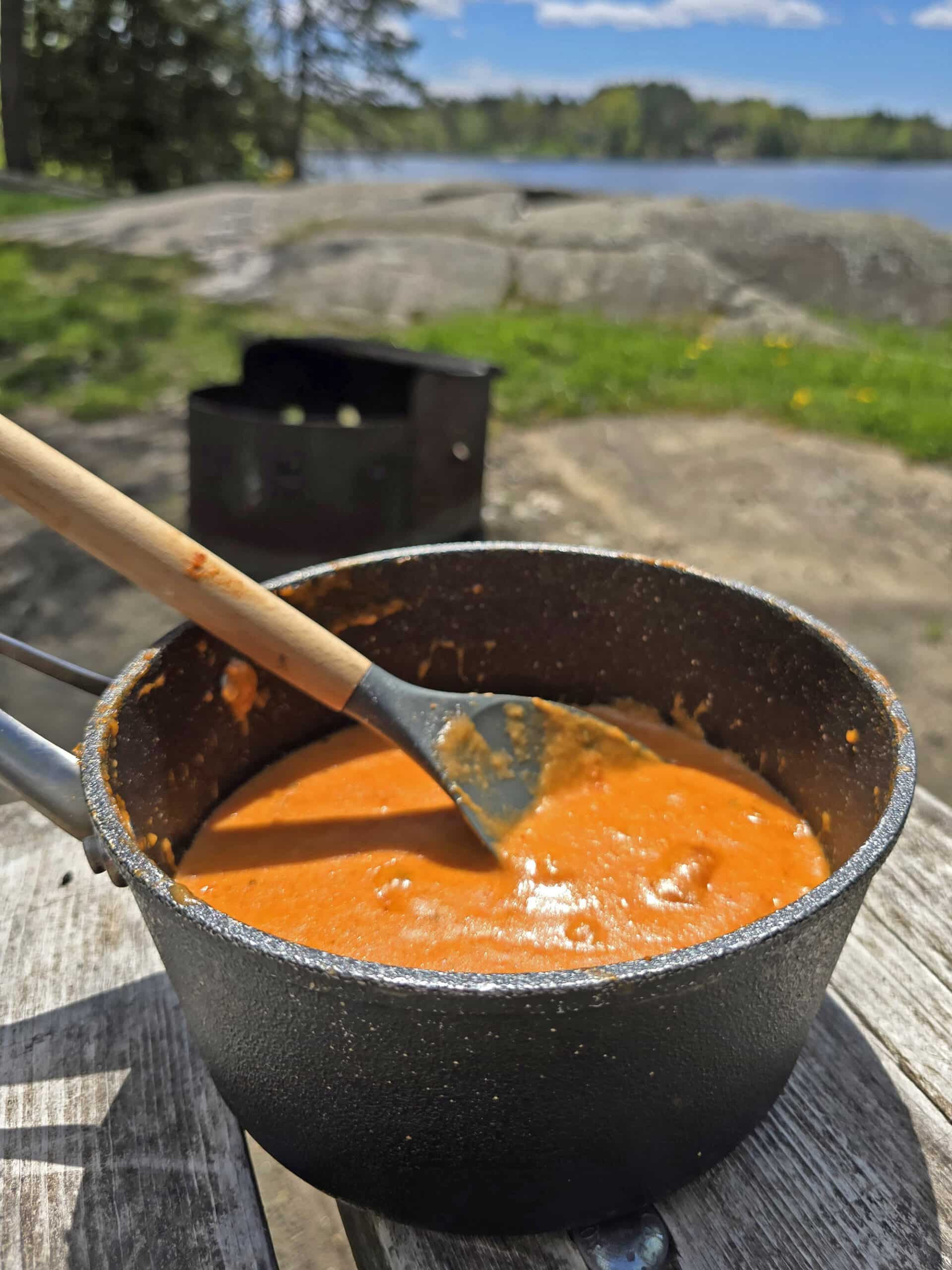 A pot of hot cheddar queso dip.