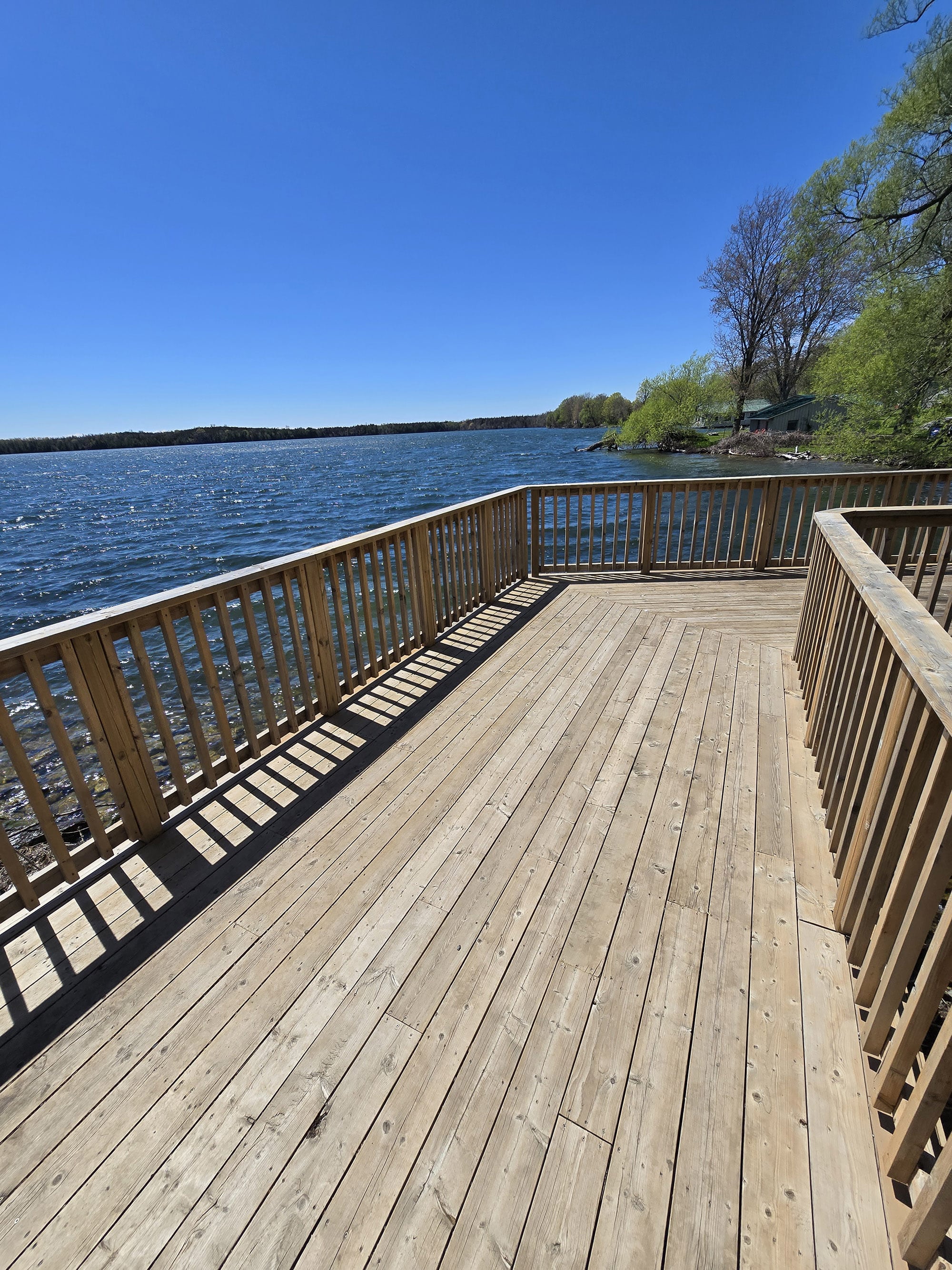 A wooden viewing platform deck on the side of Lake on the Mountain Provincial Park.
