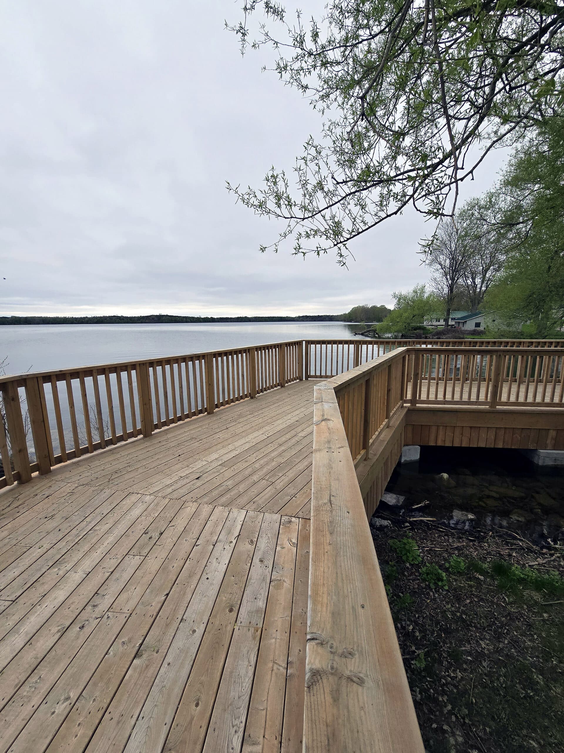 A wooden deck overlooking Lake on the Mountain.