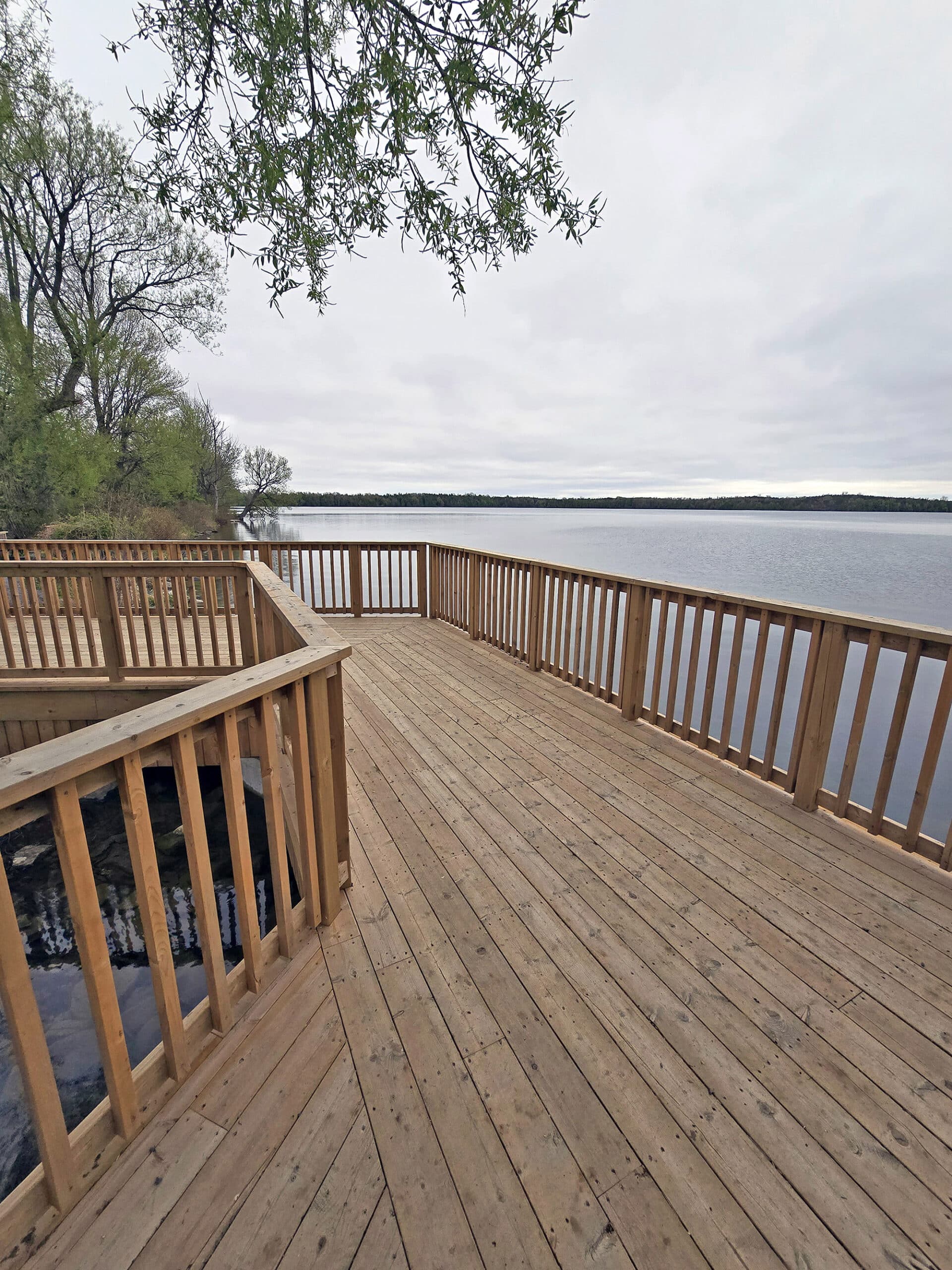 A wooden viewing platform deck on the side of Lake on the Mountain Provincial Park.