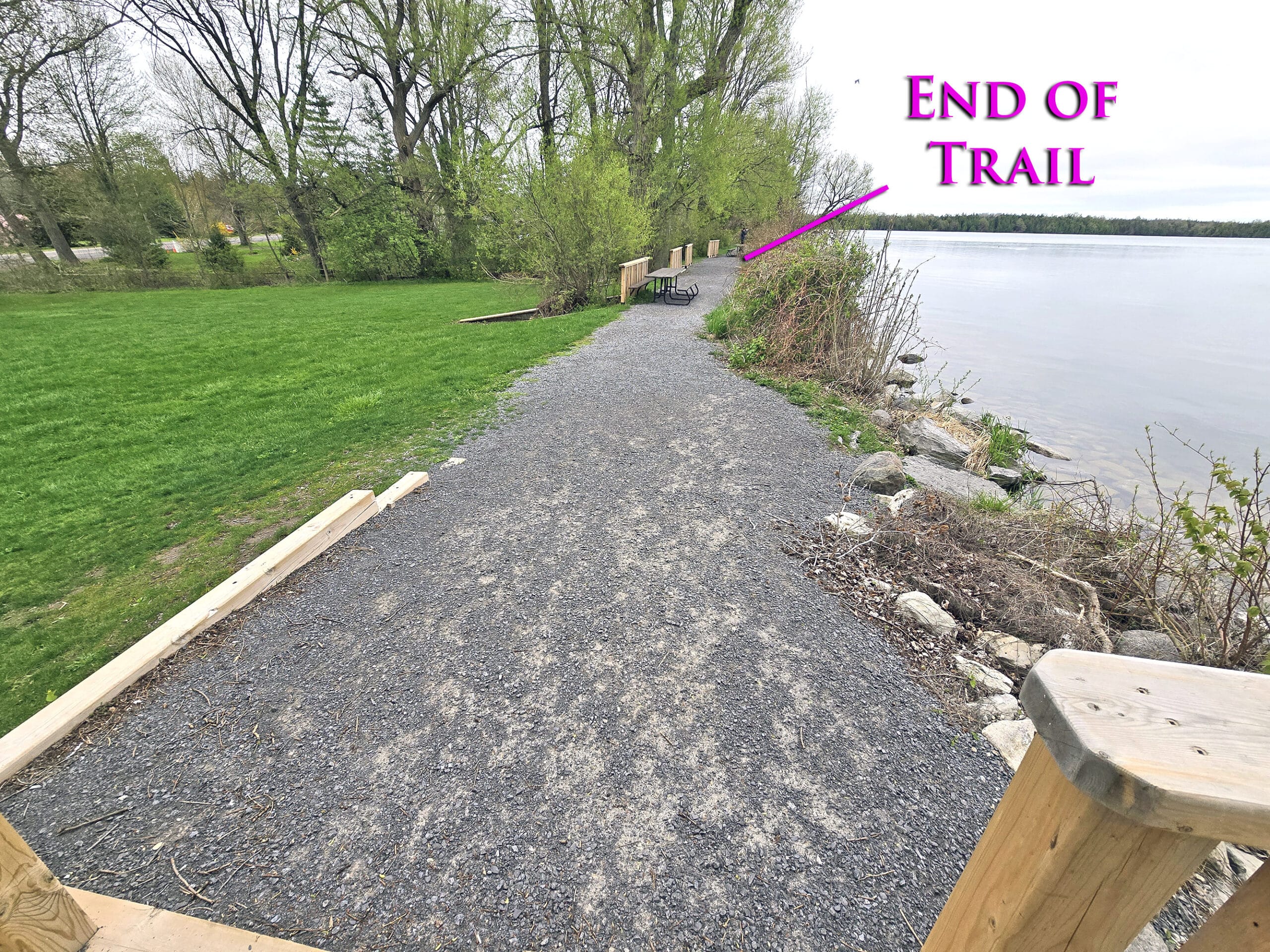A wide gravel trail on the side of Lake on the Mountain.