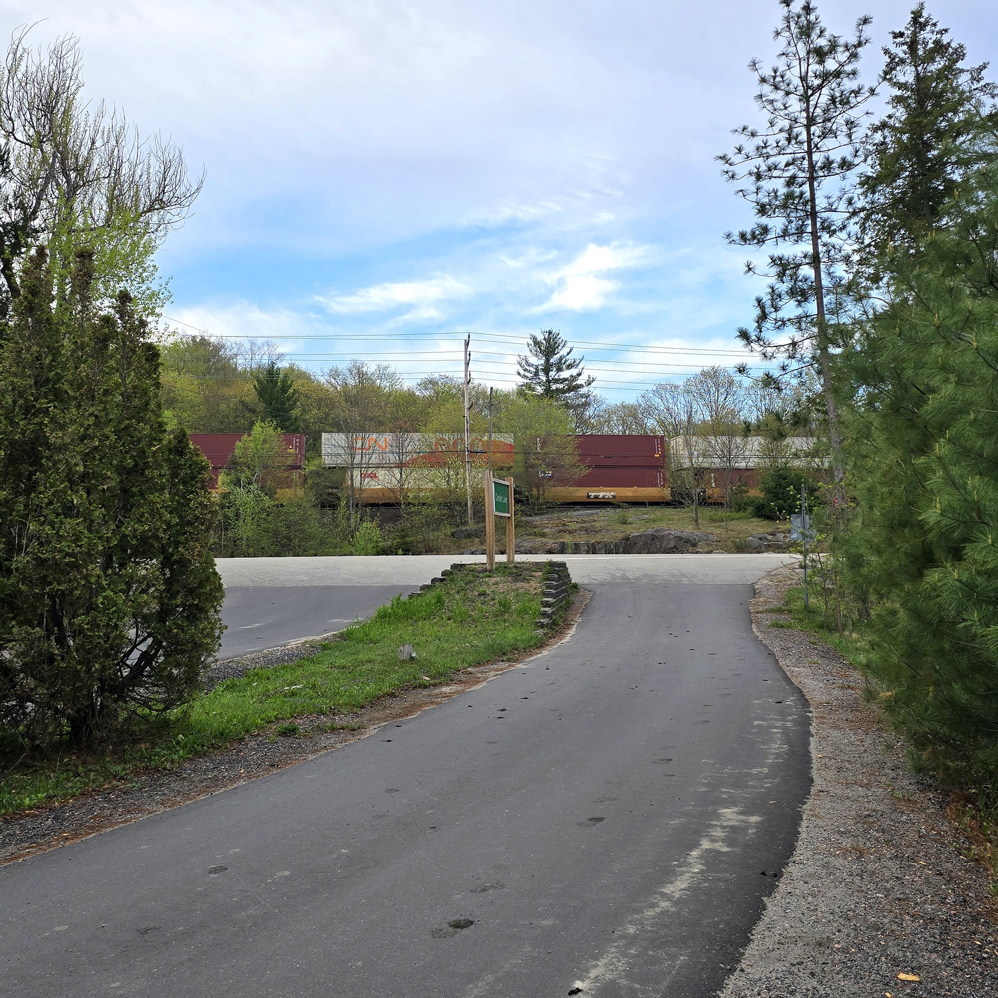 A train passing the entry to the campground.